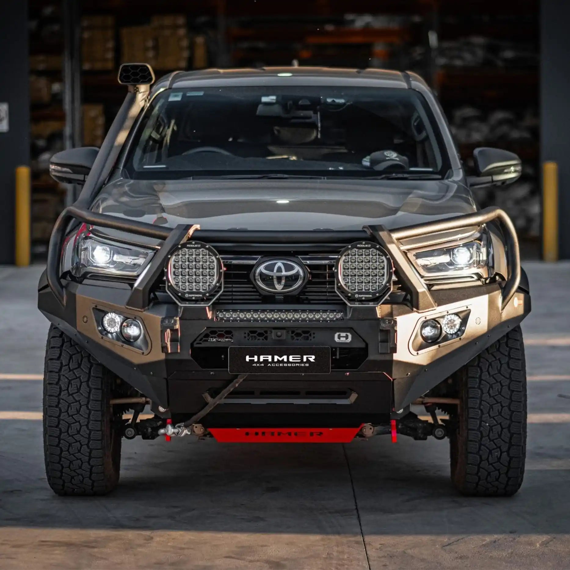 Angled front of Toyota Hilux Rogue (2022–Present) showing Hamer King Plus Bull Bar, winch ready design and rugged matte black finish.