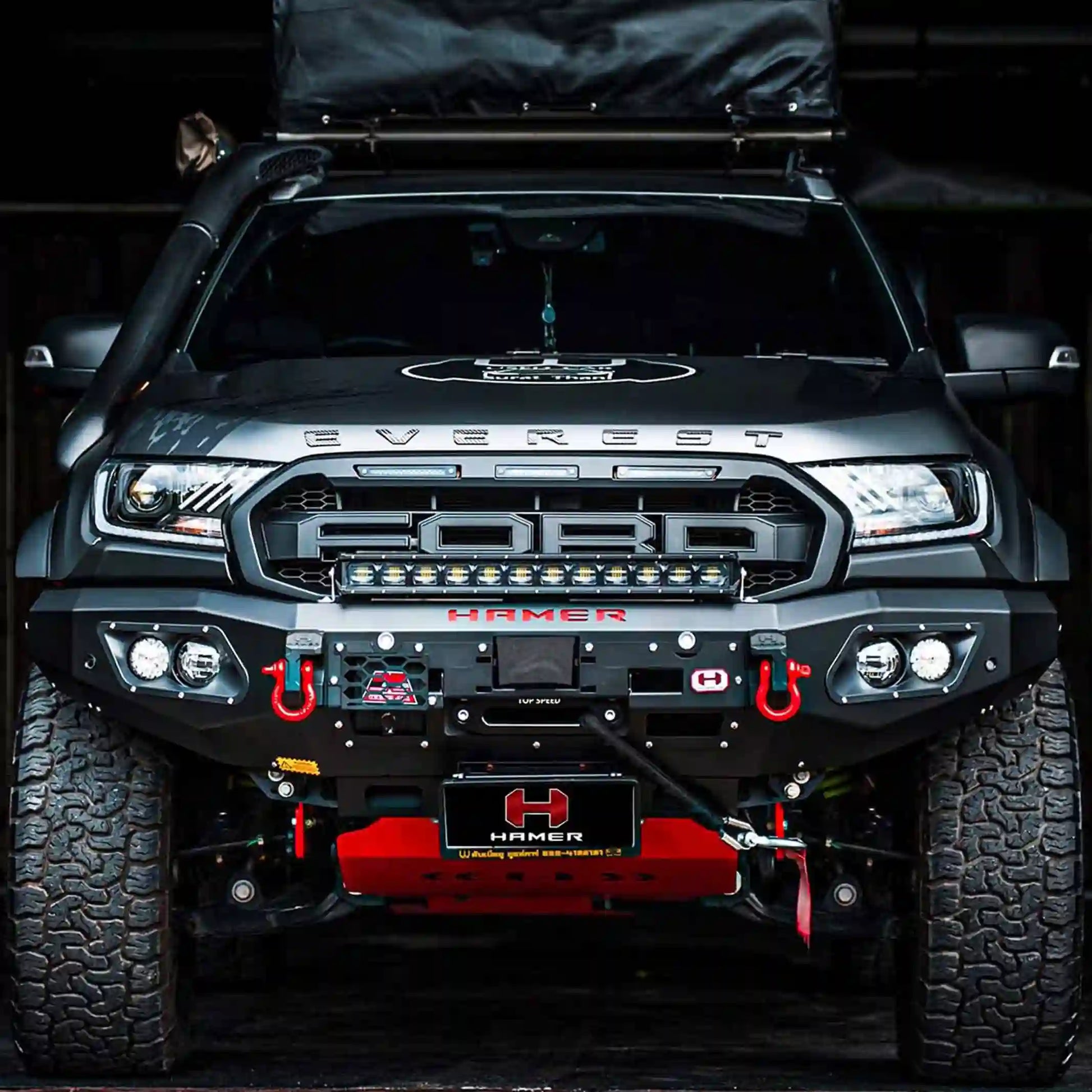 Front installed close-up of the Hamer King Series Bull Bar on a Ford Everest (2015–2022) by Elevated 4x4 in Australia. This off-road accessory features integrated LED lights, winch lever access, and a durable matte black powder coat finish, offering premium protection, style, and functionality for all Australian 4WD adventures.