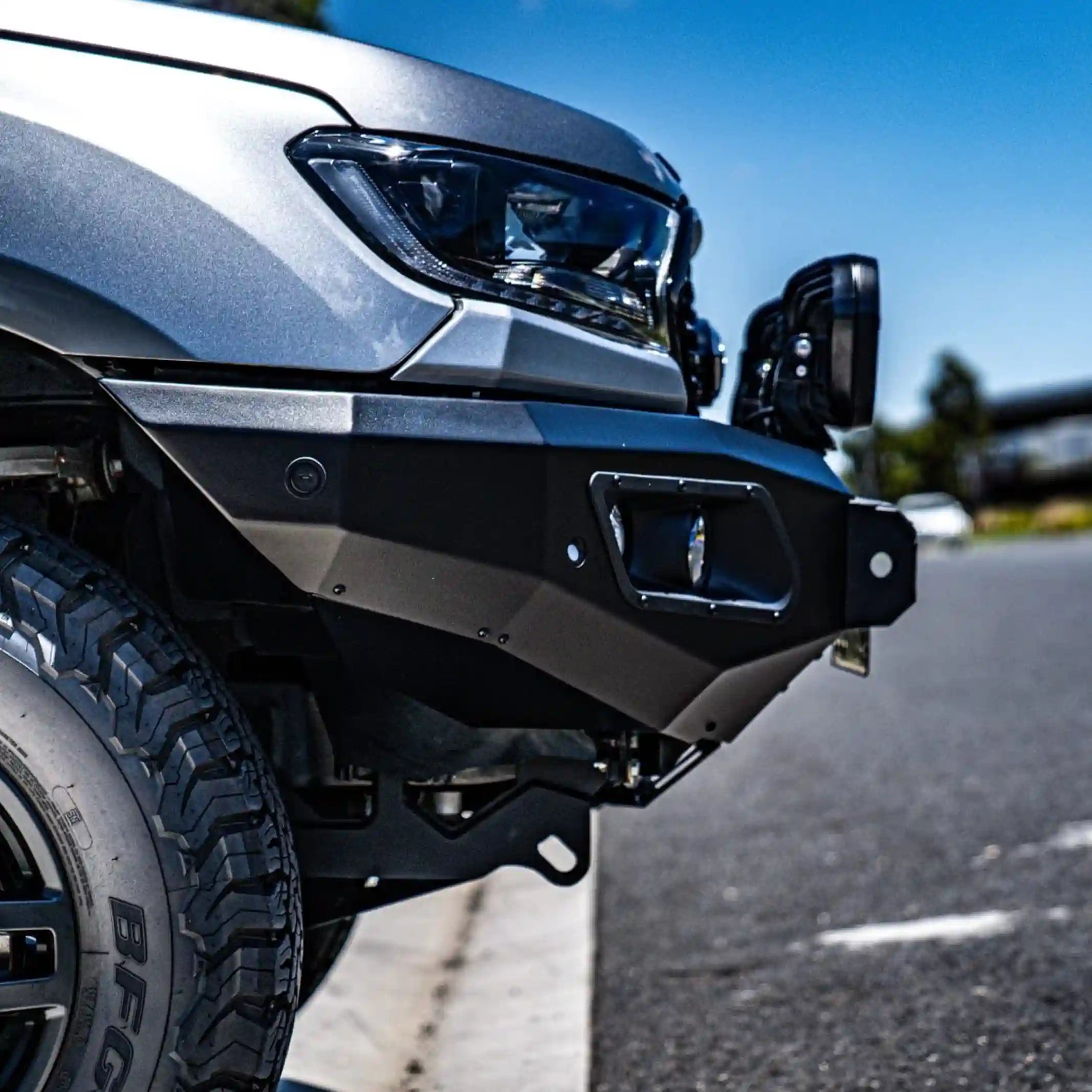 Close-up left installed view of the Hamer King Series Bull Bar on a Ford Everest (2015–2022) by Elevated 4x4. Highlighting matte black finish, ADR and airbag compliance, and sleek full bumper replacement, this off-road accessory provides Australian drivers with confidence, safety, and rugged style for challenging terrains.