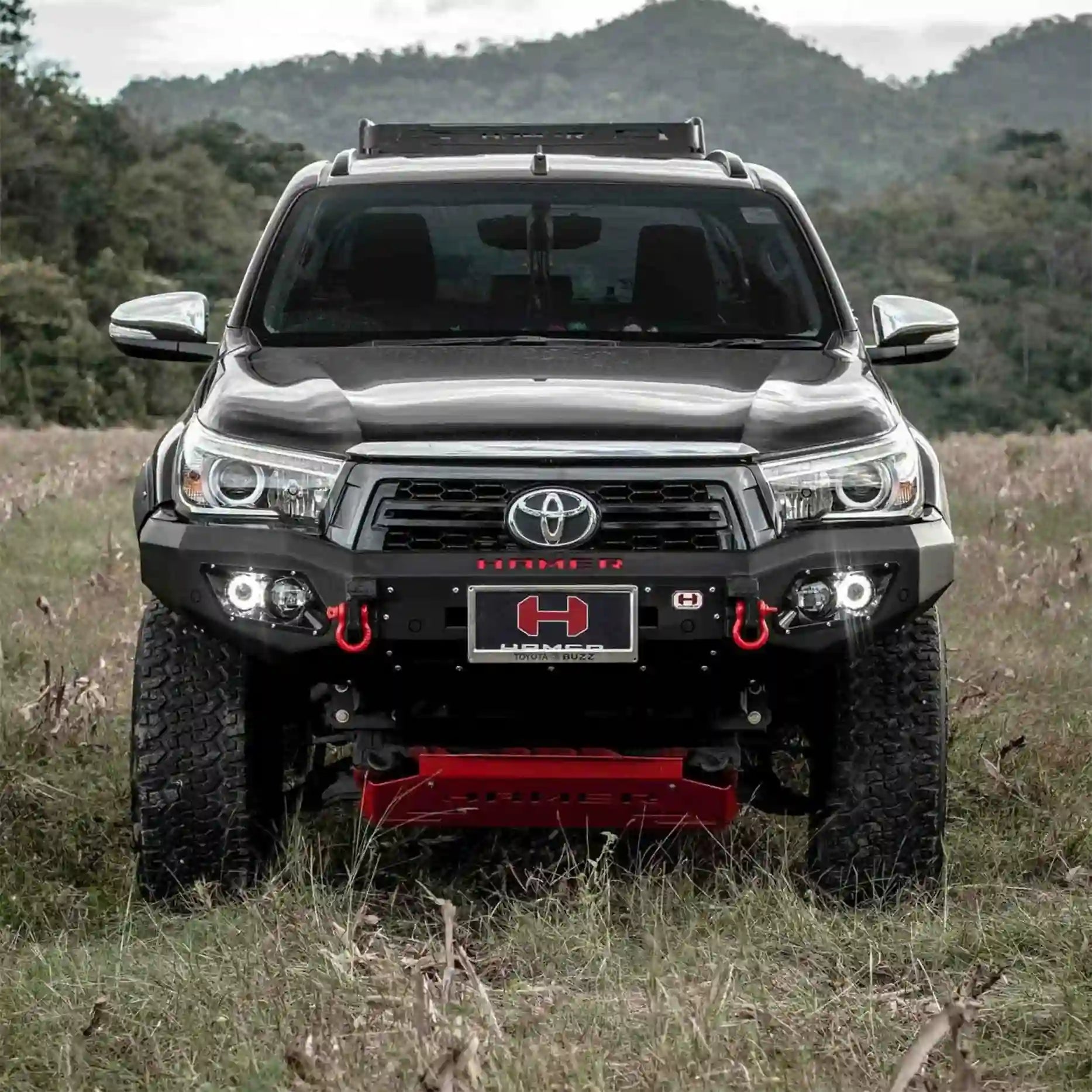 Front angle of Hilux 2018–2020 fitted with Hamer King Bull Bar, rugged design, LED lights and recovery points for off-road use.