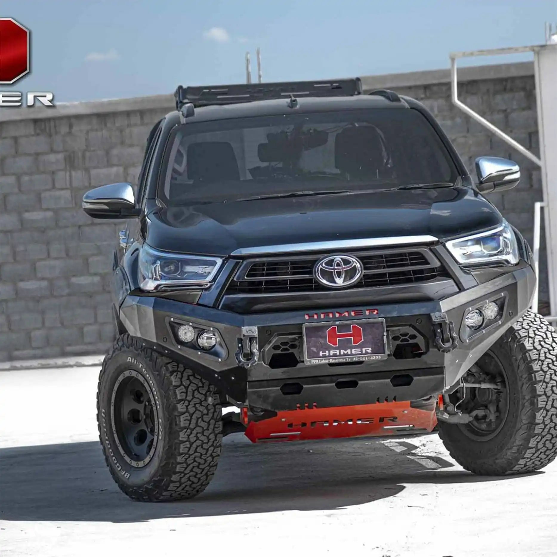 Front angle of Toyota Hilux (2020–2023) showcasing Hamer King Bull Bar, rugged 3mm steel with integrated LED lights for visibility.