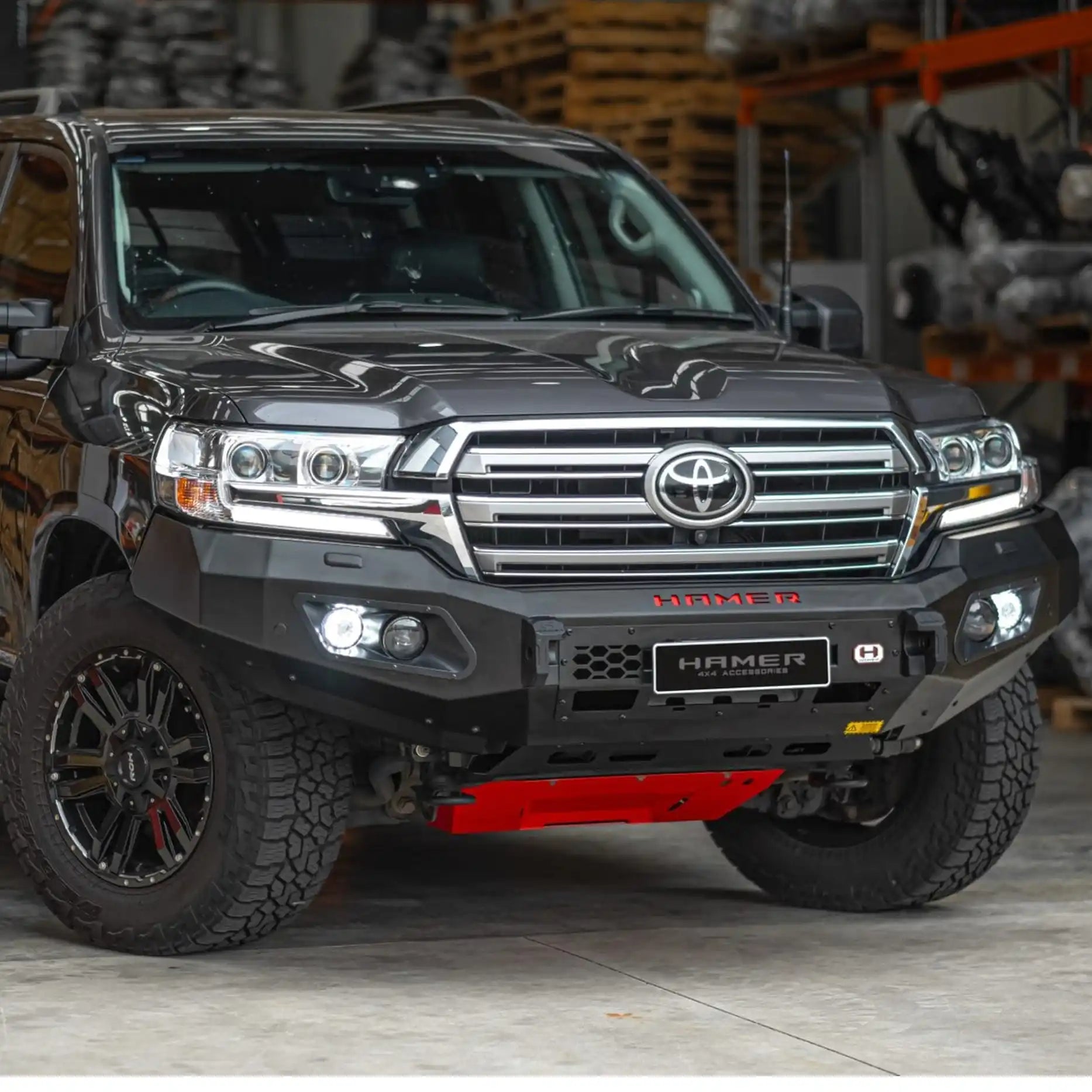 Left side of Toyota Landcruiser 200 Series with Hamer King Bull Bar, seamlessly integrated matte black bumper replacement with E-Mark LED lights.