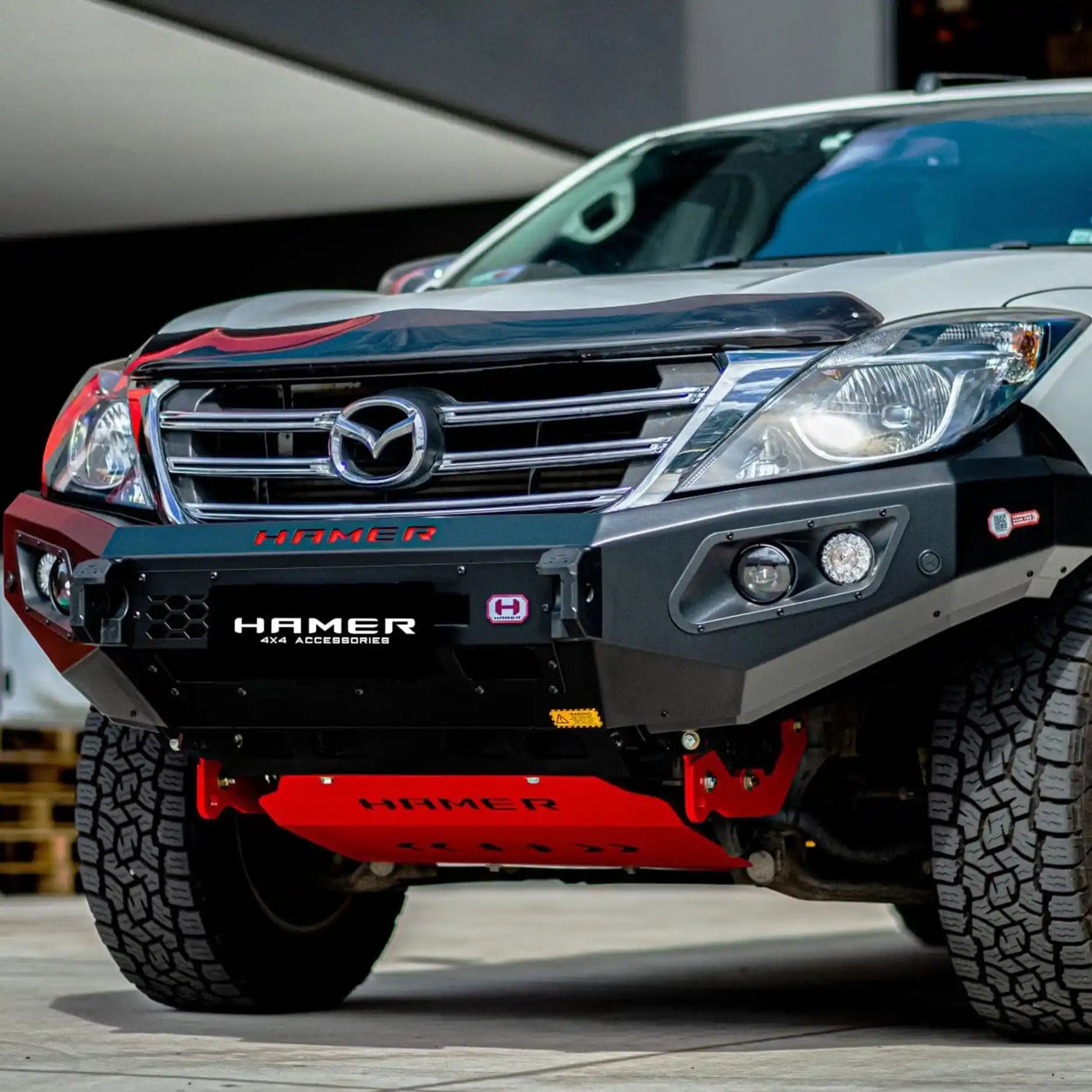 Right side view of the Hamer King Series Bull Bar on Mazda BT-50 2012–2020, showing integrated LED lighting, number plate flip, and strong Australian-engineered design.