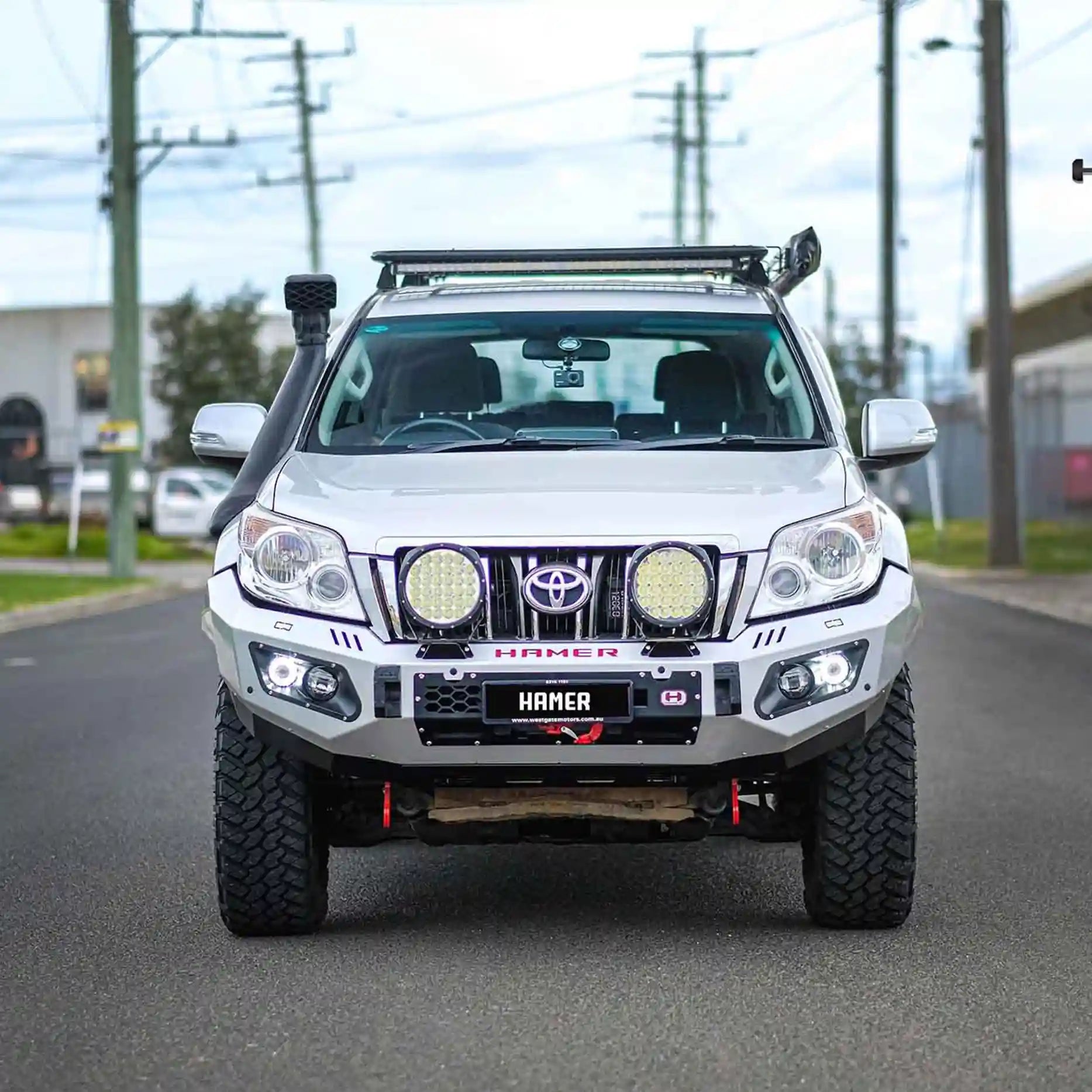 Front angled shot of Toyota Prado 150 Series (2009–2013) featuring Hamer King Bull Bar, 3mm steel with recovery points and winch ready design.