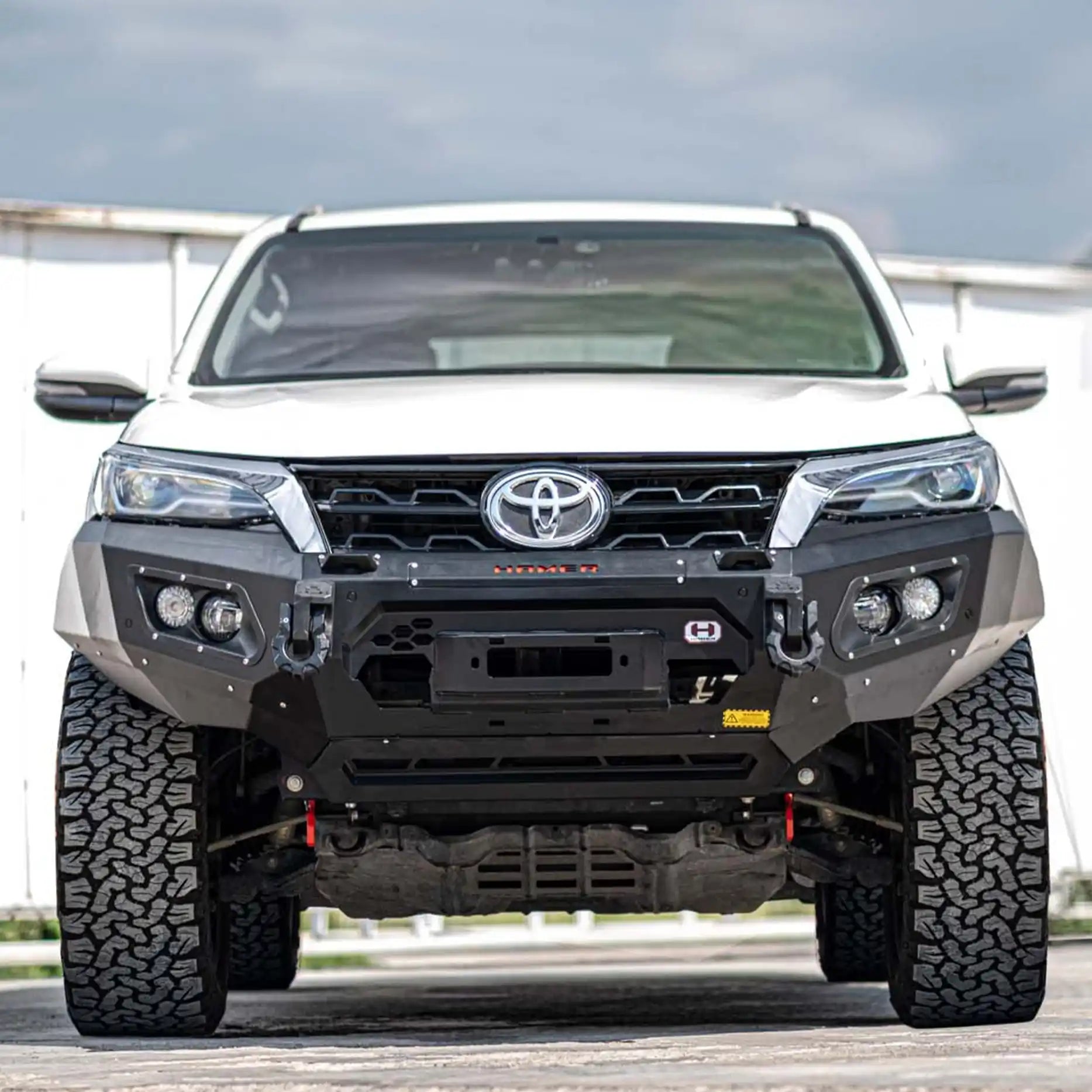 Front angle of Fortuner 2020 fitted with Hamer King Bull Bar, rugged steel, winch compatible with integrated LED lighting.