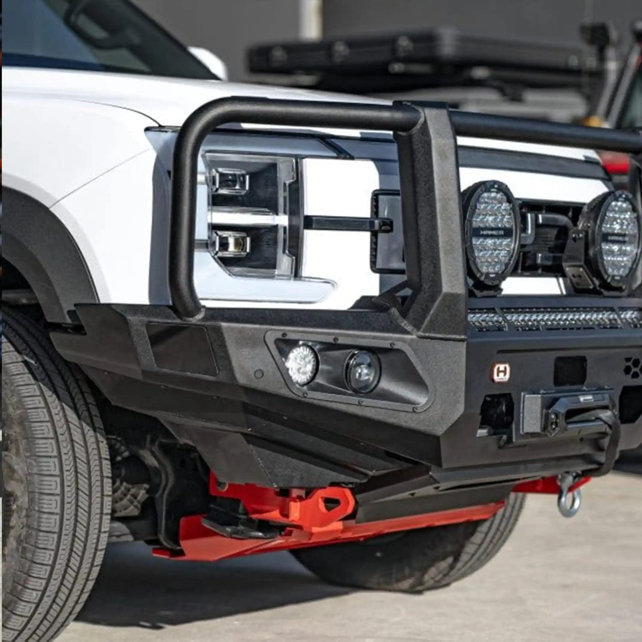 left installed view of byd shark 6 with hamer king series plus bull bar highlighting sleek fit recovery points and integrated fog lights elevated 4x4