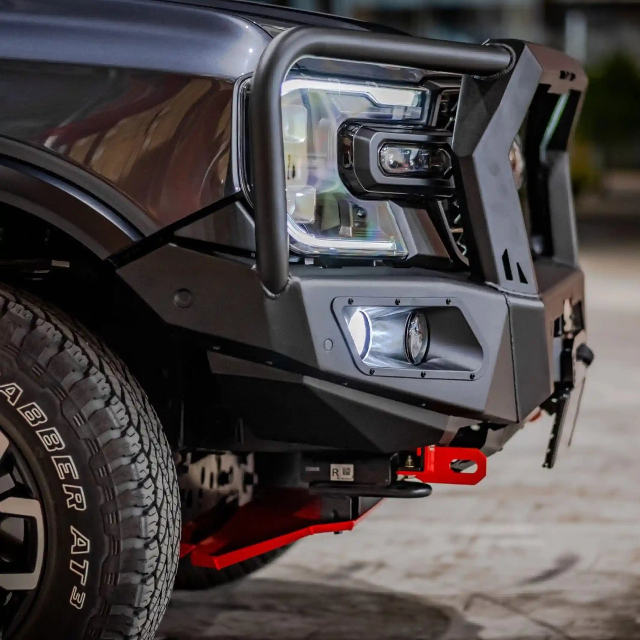 close-up detail of hamer king series plus bull bar fitted on ford everest 2022 showing matte black steel construction and led fog lamps elevated 4x4
