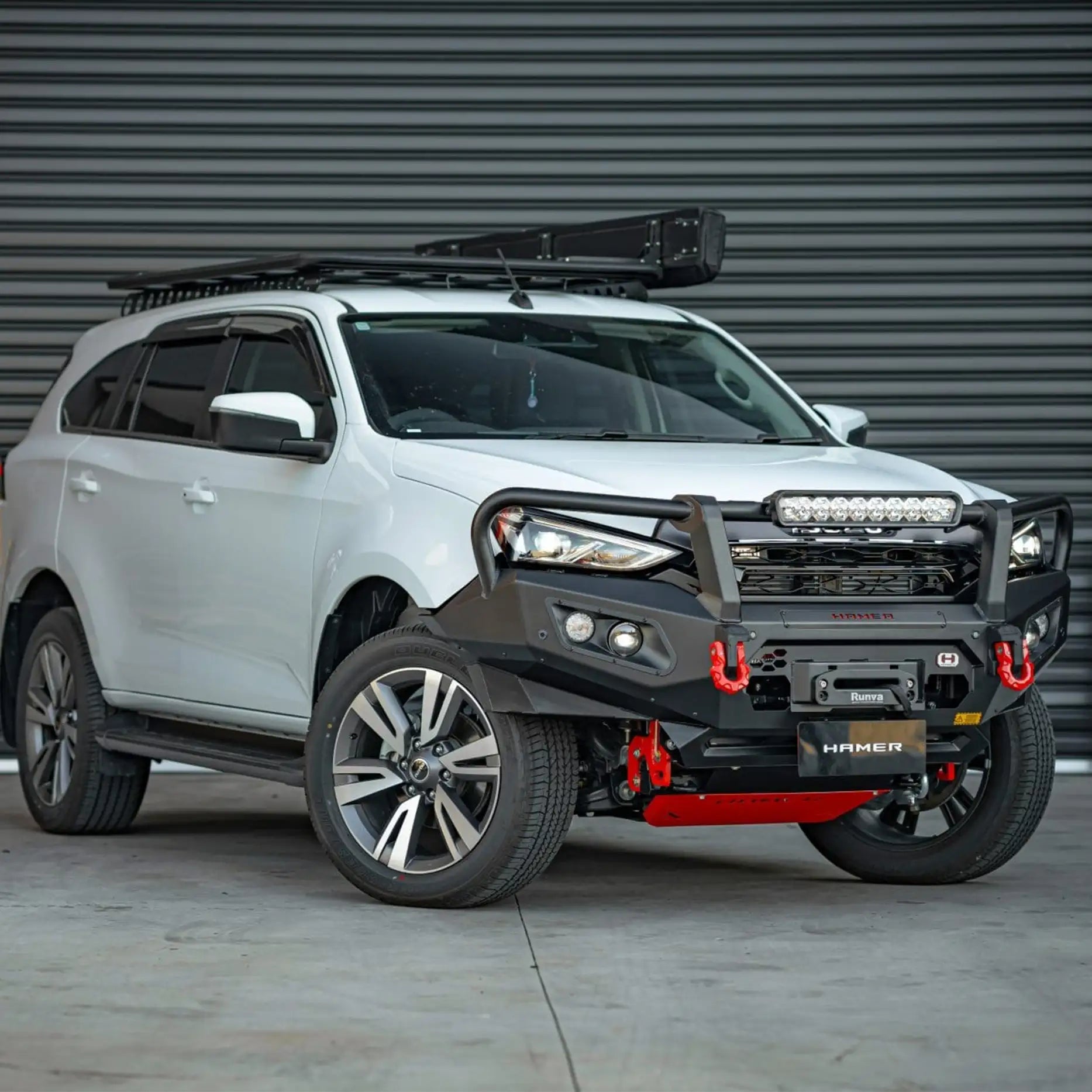 Left side view of Isuzu MU-X 2021–2024 fitted with Hamer King Series Plus Bull Bar, designed with seamless integration, aerial/light mounting points, and rugged matte black finish.
