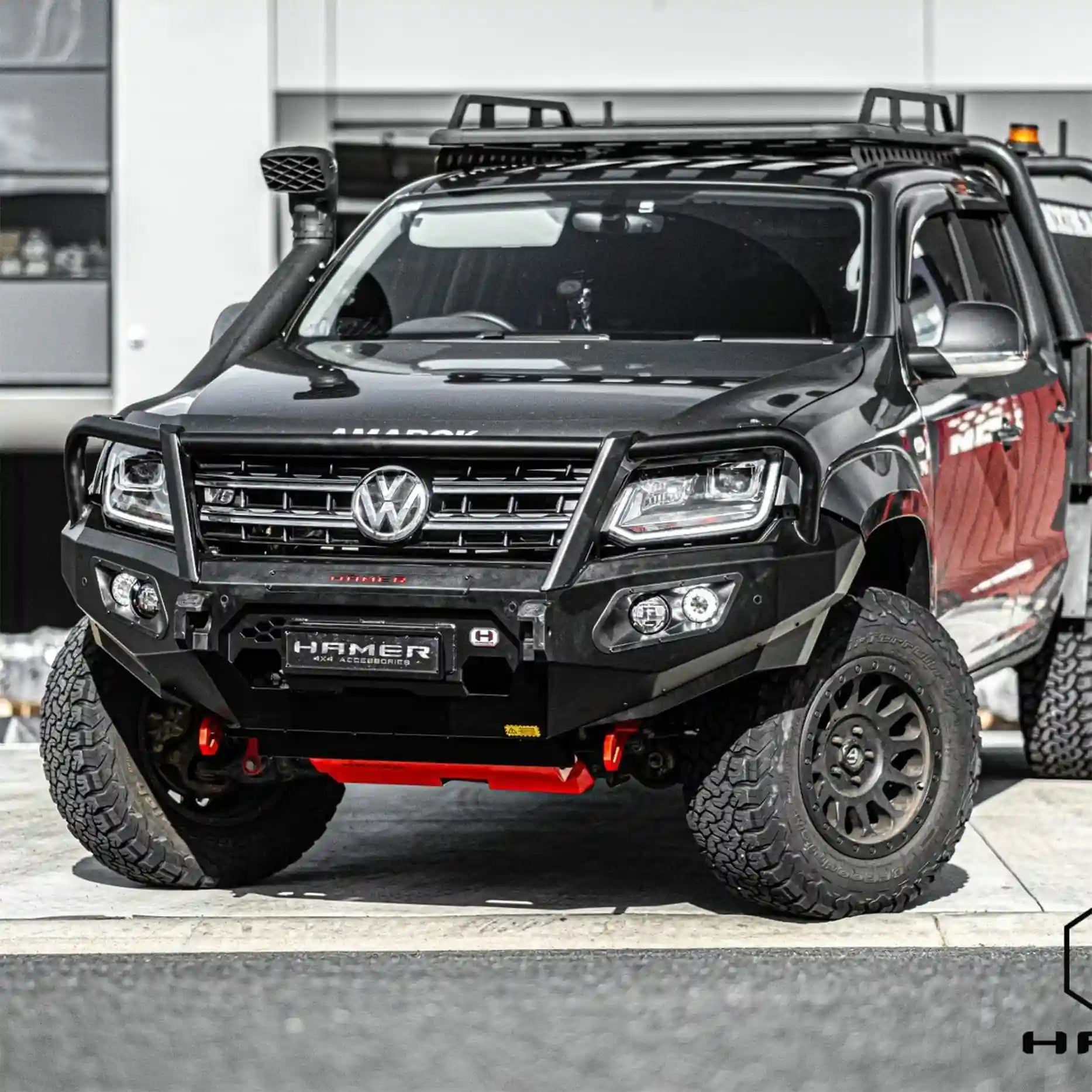 Right profile of Volkswagen Amarok equipped with Hamer King Series Plus Bull Bar, featuring sleek design, aerial mounts, and E-Mark certified LED lighting.