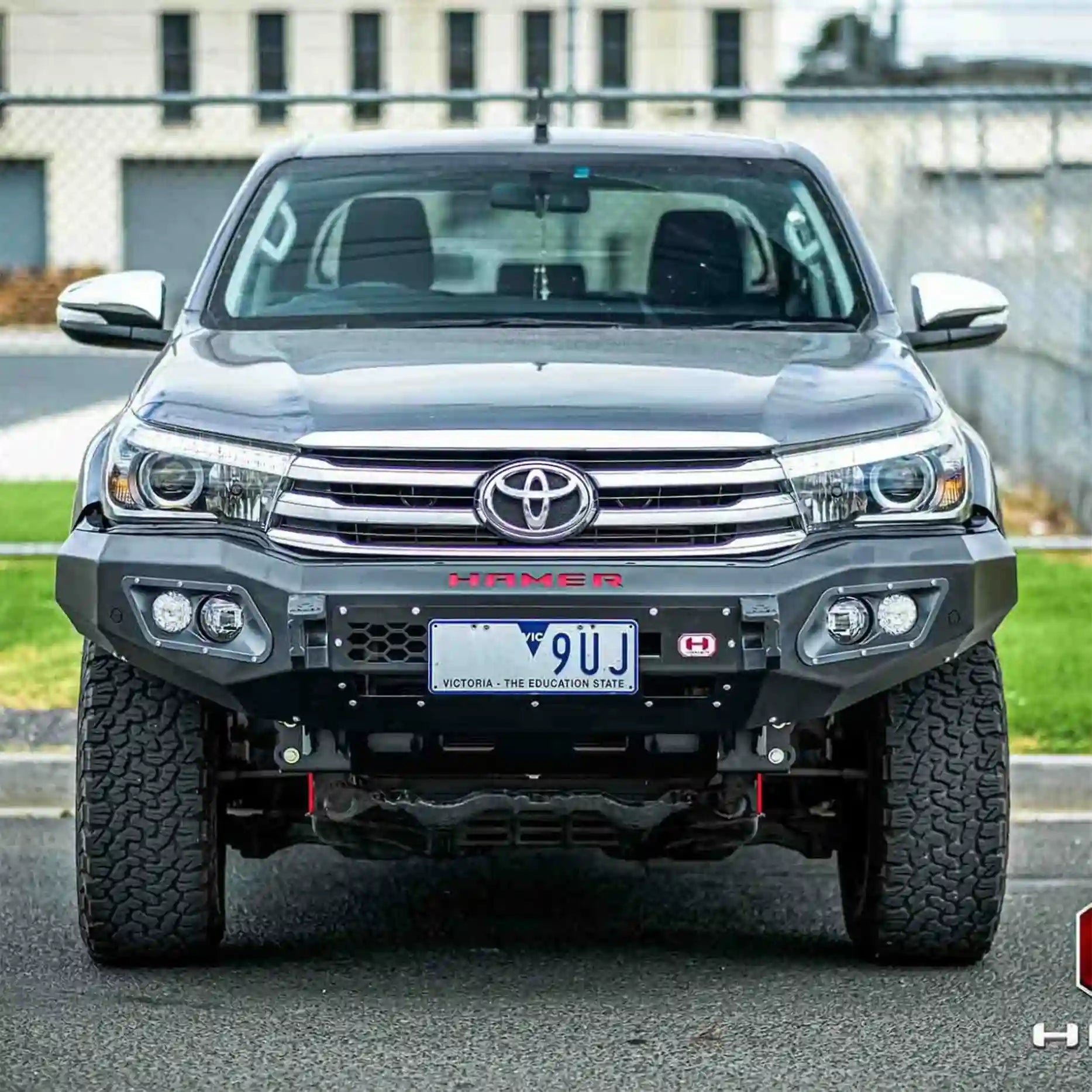 Off-road front shot of Hilux 2015–2018 with Hamer King Bull Bar, matte black finish, rated recovery points, ADR compliant design.