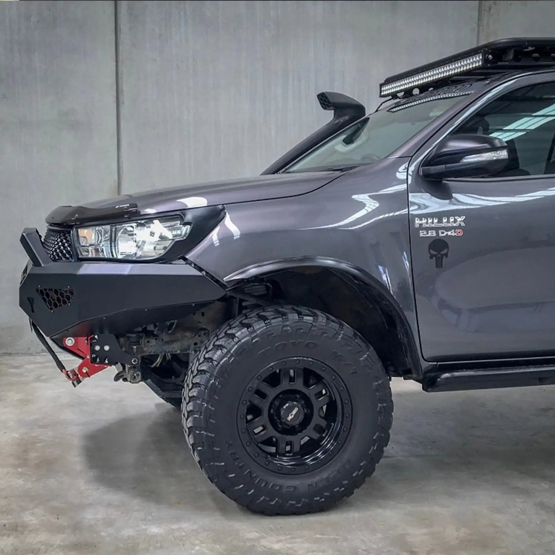 Side profile of the Toyota Hilux N80 with the Offroad Animal Predator Bull Bar, emphasizing its aerodynamic lines and aggressive off-road geometry. Available from Elevated 4x4 Cardiff, this ADR-compliant bar offers superior protection and winch mounting capability for serious off-road enthusiasts.