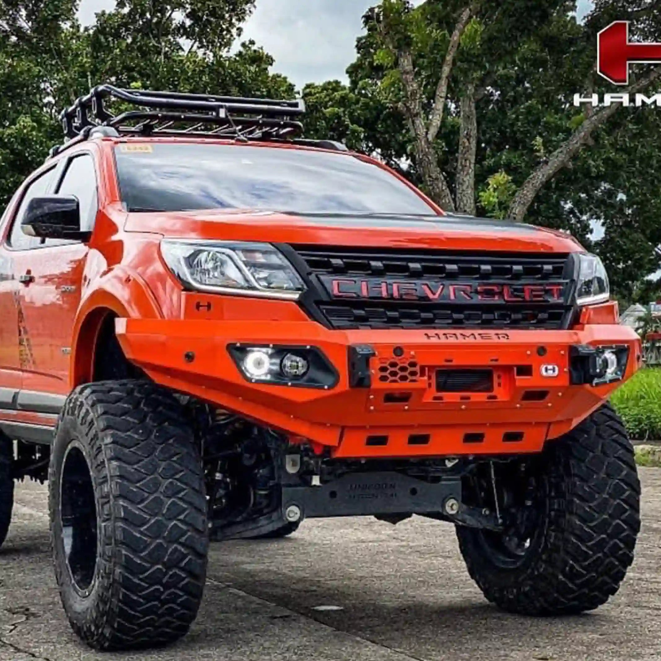 left angle installed hamer king series bull bar fitted to holden colorado highlighting fog lamps recovery points elevated 4x4