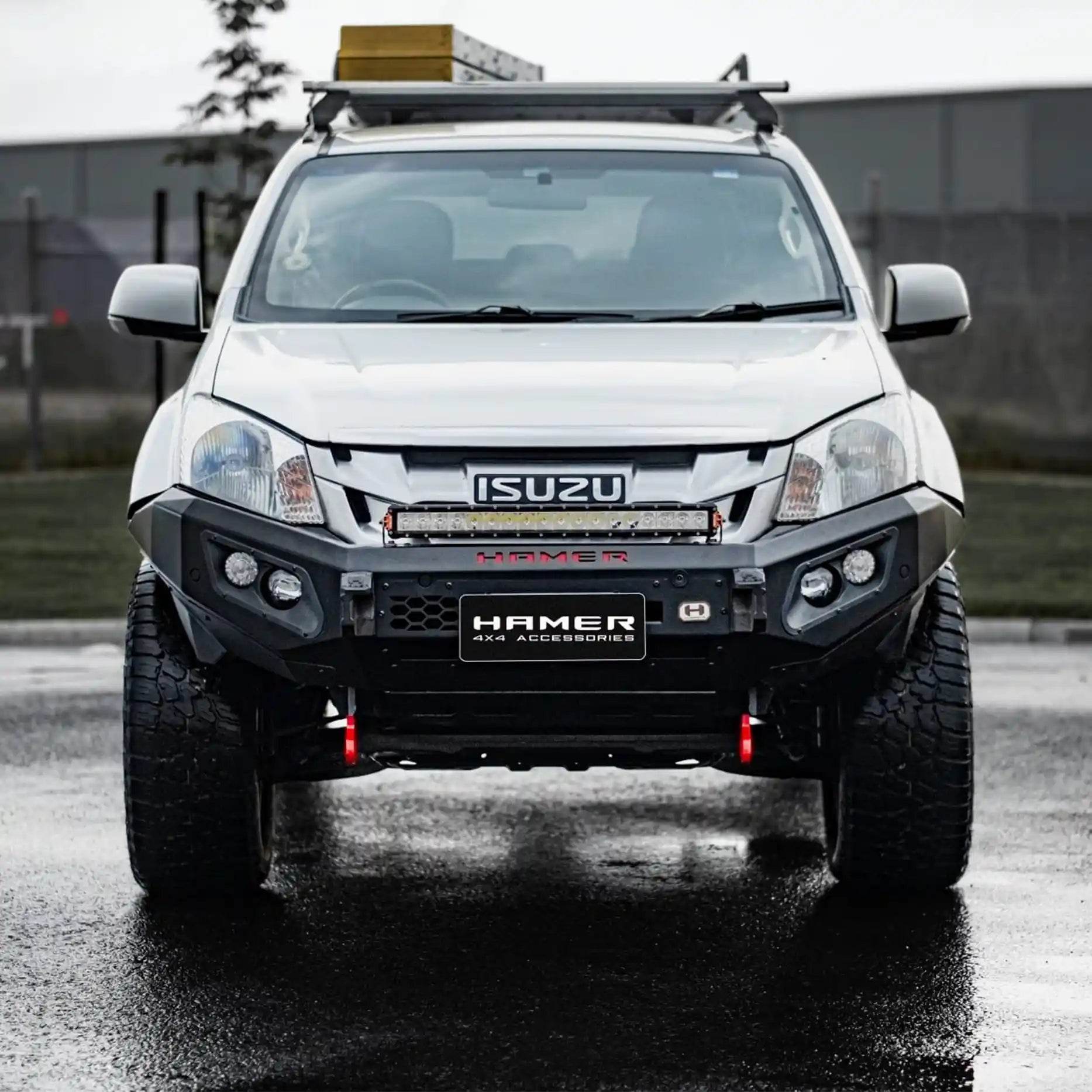 Front view of Isuzu D-Max (2012–2016) fitted with Hamer 4x4 King Series Bull Bar, ADR compliant, winch ready, with LED fog lamps and matte black finish.
