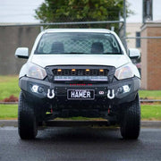 Front view of Isuzu D-Max (2016–2020) fitted with Hamer 4x4 King Series Bull Bar, showcasing ADR compliance, LED fog lamps, winch readiness, and matte black finish.
