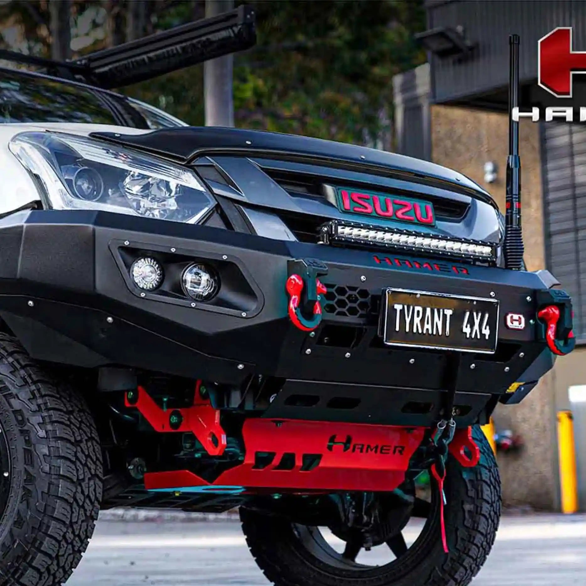 Left side profile of Isuzu D-Max with Hamer King Series Bull Bar, matte black powder-coated finish, ADR compliant, and mounting points for lights.