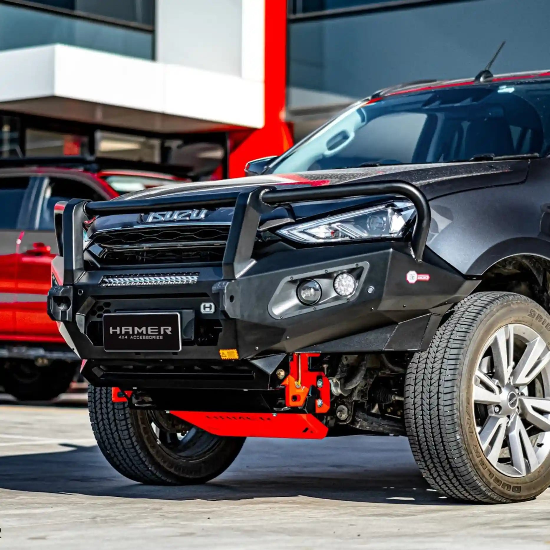 Right side angle of Isuzu MU-X 2021–2024 featuring the Hamer King Series Plus Bull Bar, showing number plate flip option, stylish finish, and full bumper bar replacement.