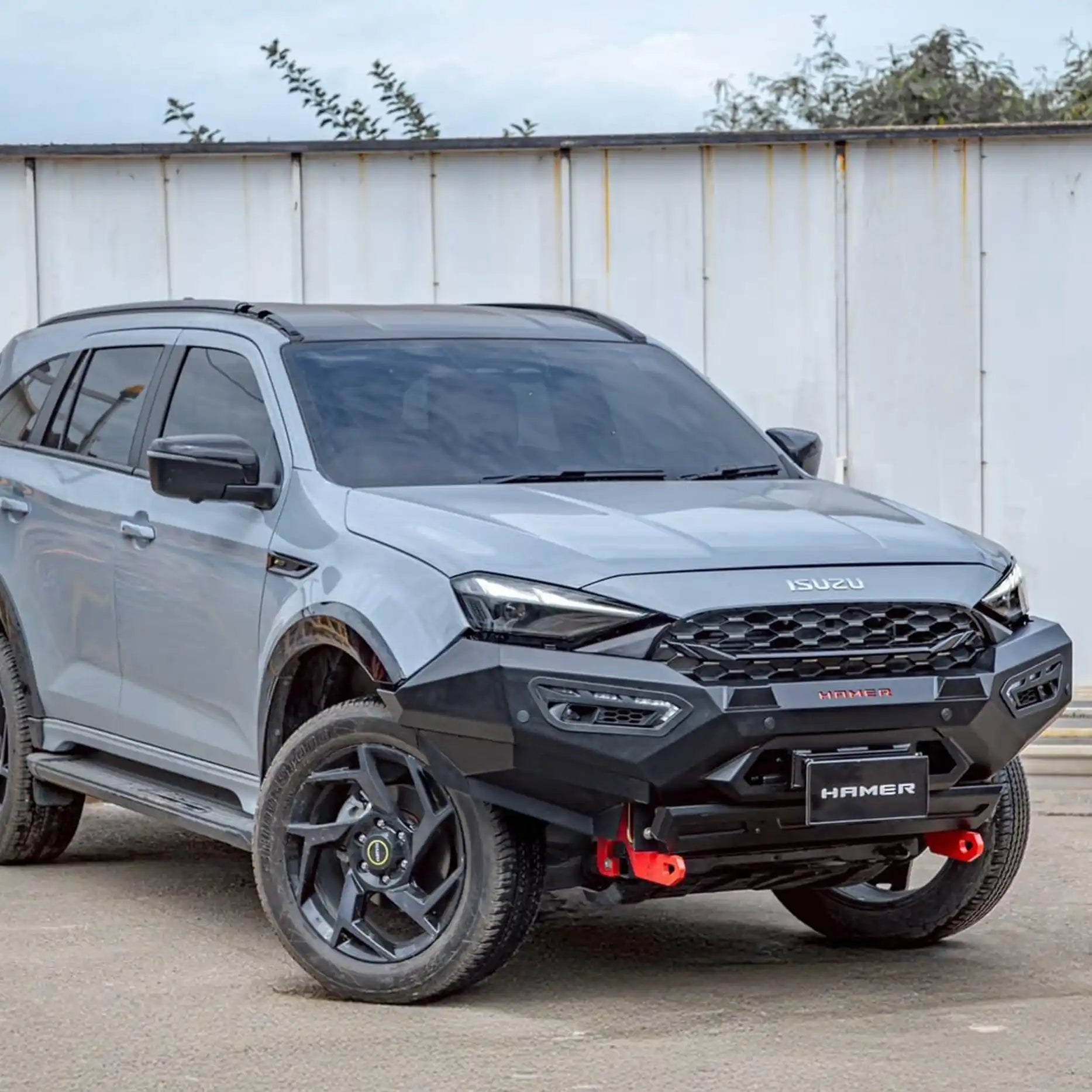Left angle view of 2025 Isuzu MU-X fitted with Hamer Atlas Series Bull Bar, showing sleek bumper replacement design, factory sensor compatibility, and recovery points.