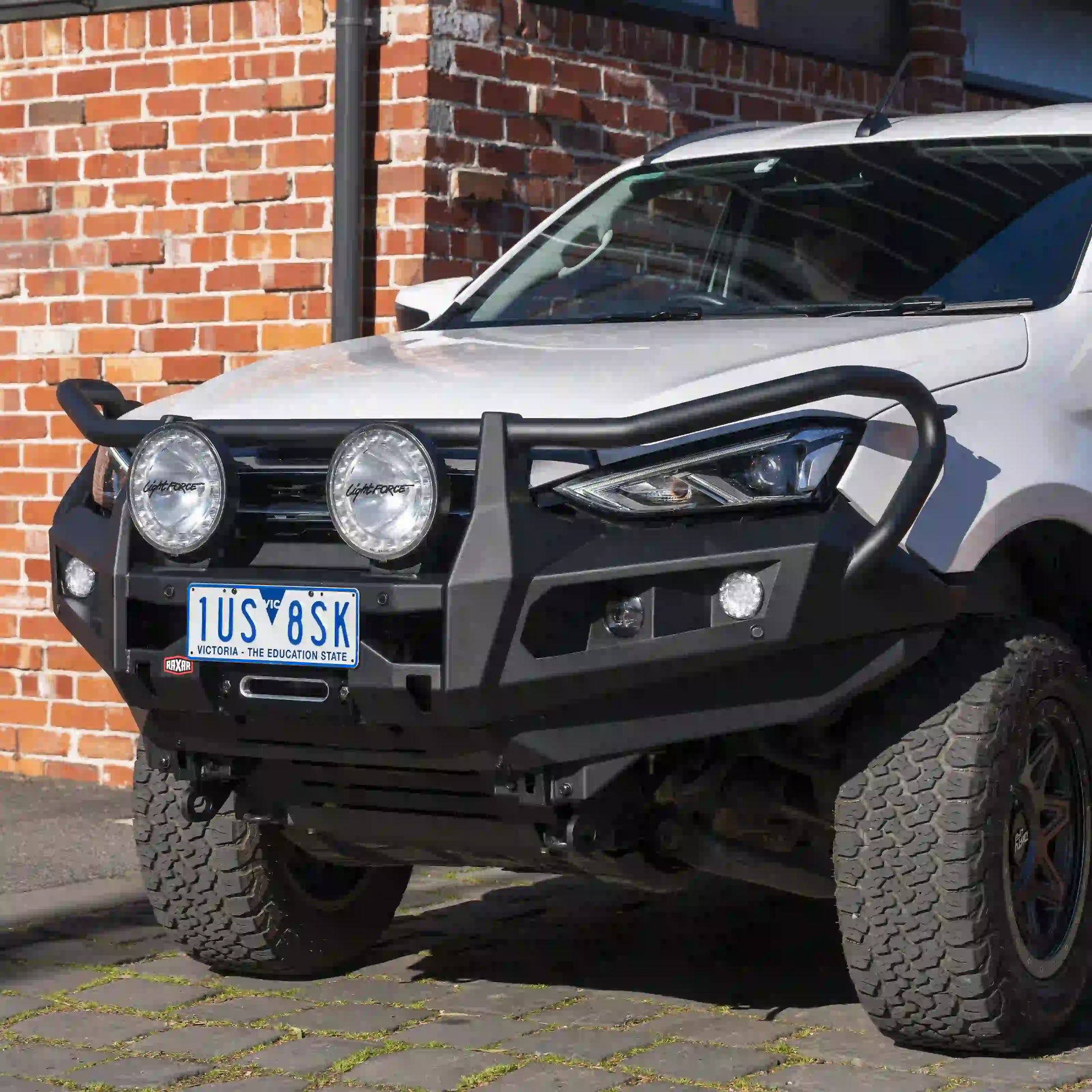 isuzu mux raxar bull bar right side view showcasing recovery points high lift jack compatibility airflow friendly split pan and rugged matte black finish this premium bull bar ensures strength style and protection for australian 4wd enthusiasts and offroad adventurers exclusively available from elevated 4x4
