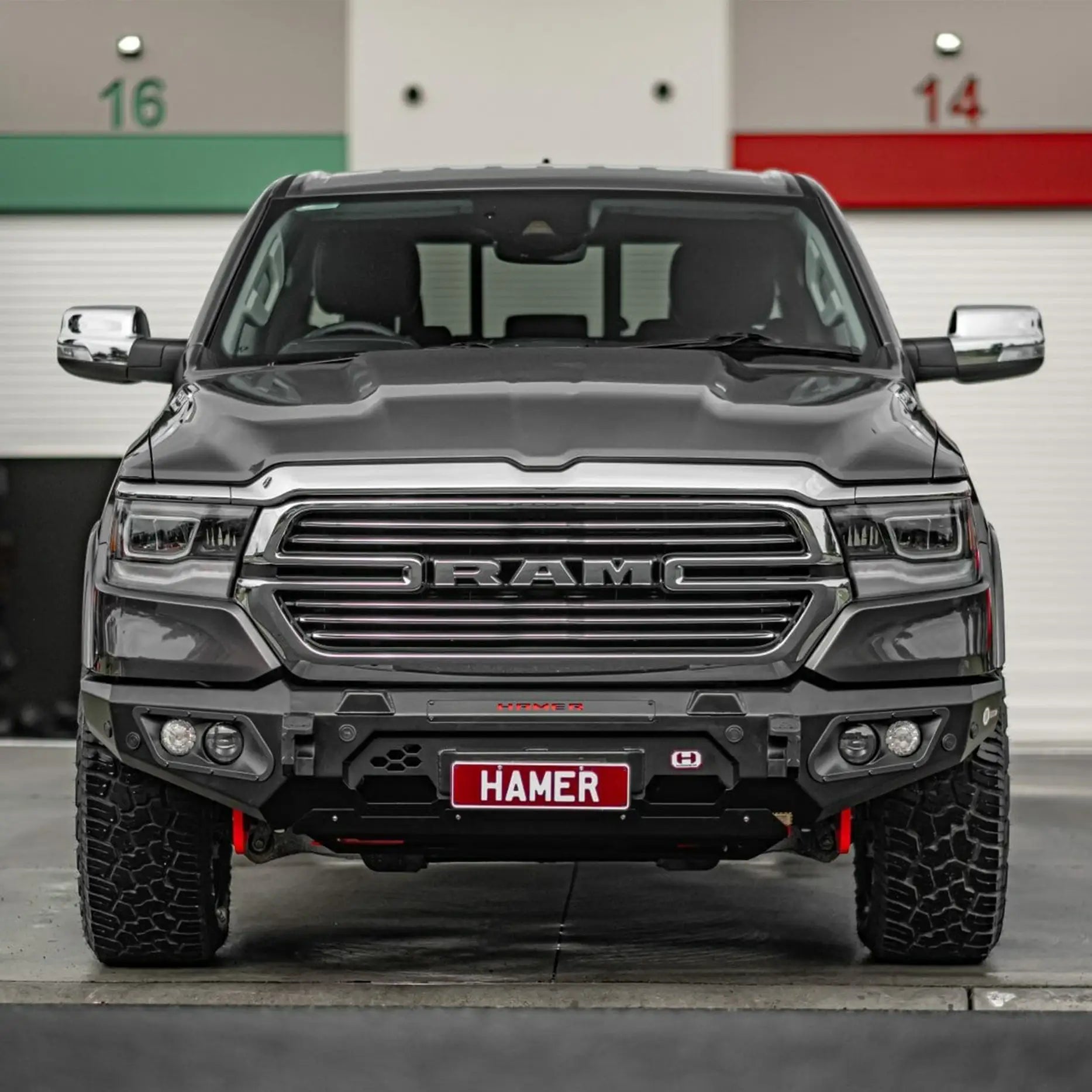 Display front of Ram 1500 DT (2021–Present) showcasing Hamer King Bull Bar, rugged design with recovery points and light bar slot.