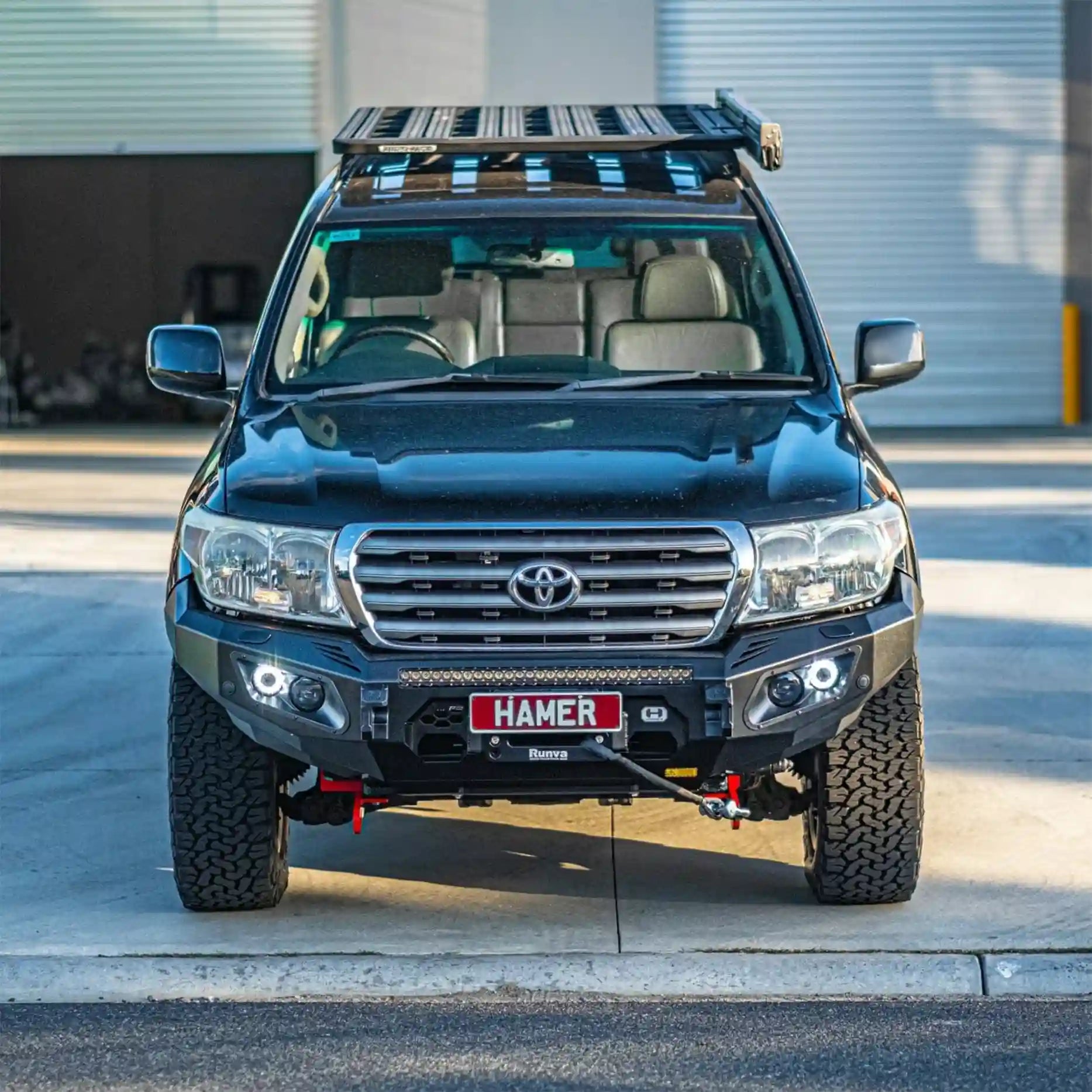 Front view of Toyota Landcruiser 200 (2008–2015) with Hamer King Bull Bar, matte black finish, ADR compliant with integrated LED lights.