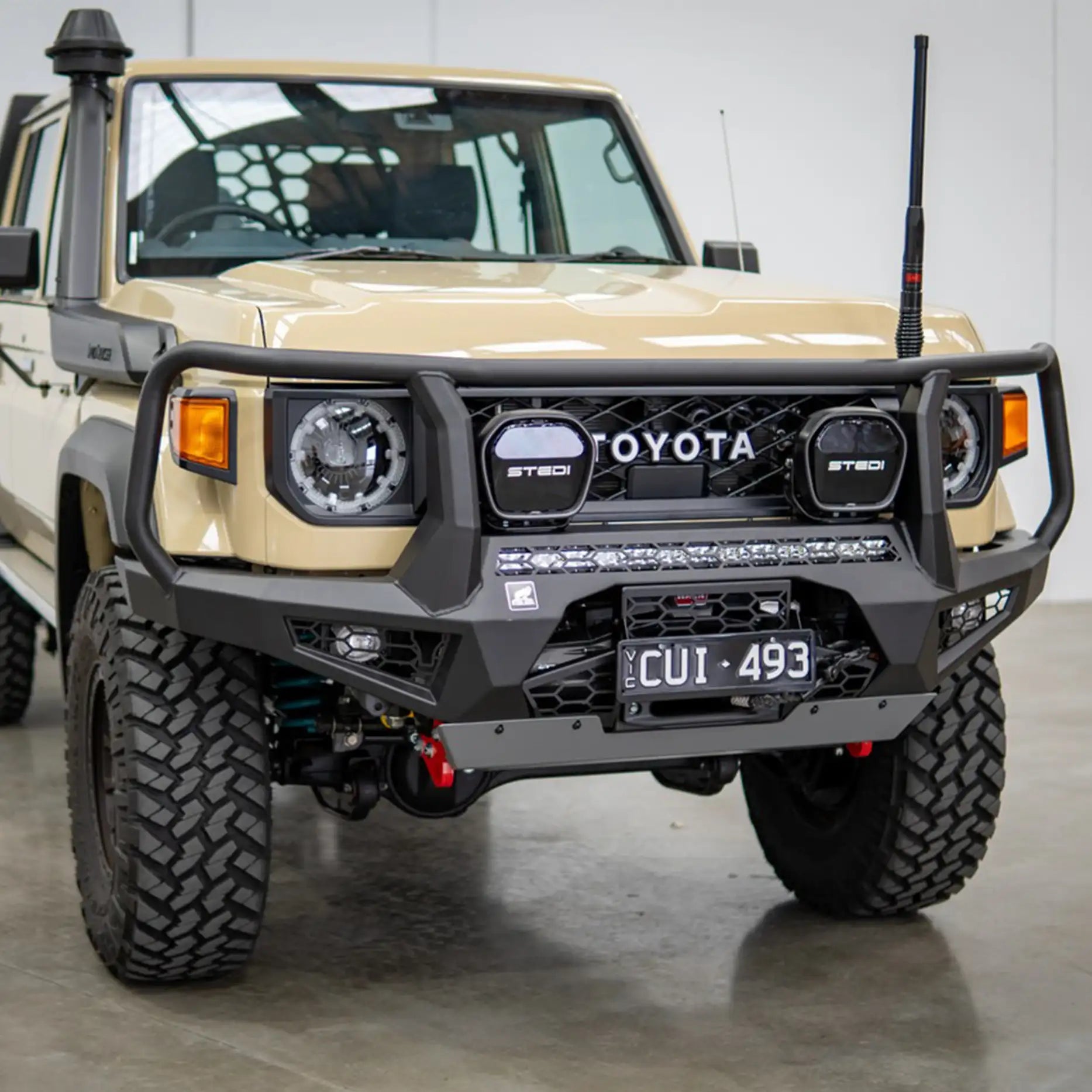Close-up left detail of the Offroad Animal Toro Bull Bar fitted to a 2024 Toyota Land Cruiser 76 Series, showing precision welding, recovery points, and stealth LED integration. Expertly fitted by Elevated 4x4, it offers a rugged yet refined finish for 4WD builds throughout the Central Coast and Hunter region.