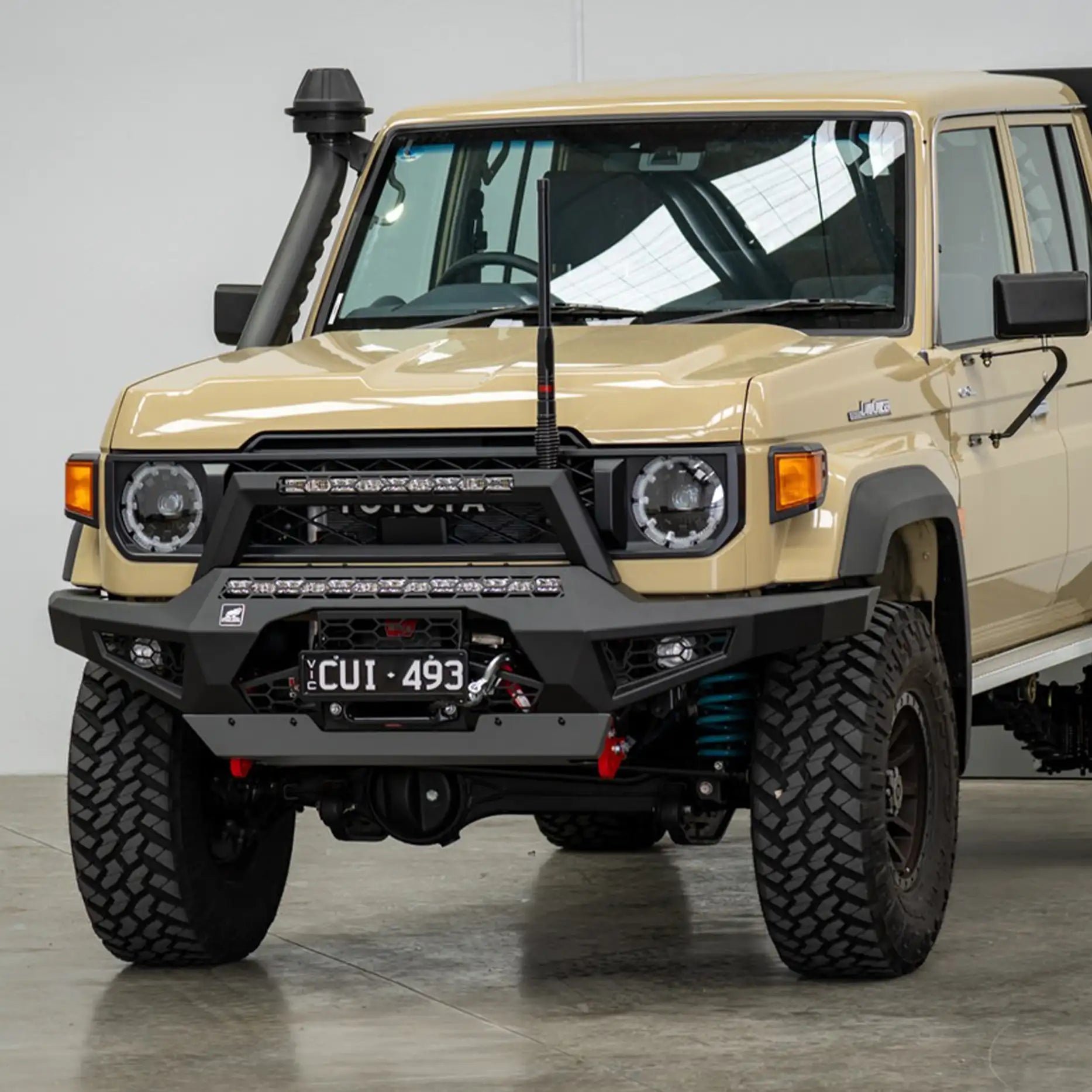 Left side profile of the Offroad Animal Predator Bull Bar on a 2024 Toyota Land Cruiser 78 Series, highlighting its sleek contour, recovery hooks, and LED light integration. Installed by Elevated 4x4, it delivers superior strength and an aggressive edge for off-road builds across Maitland, Rutherford, and Nelson Bay.