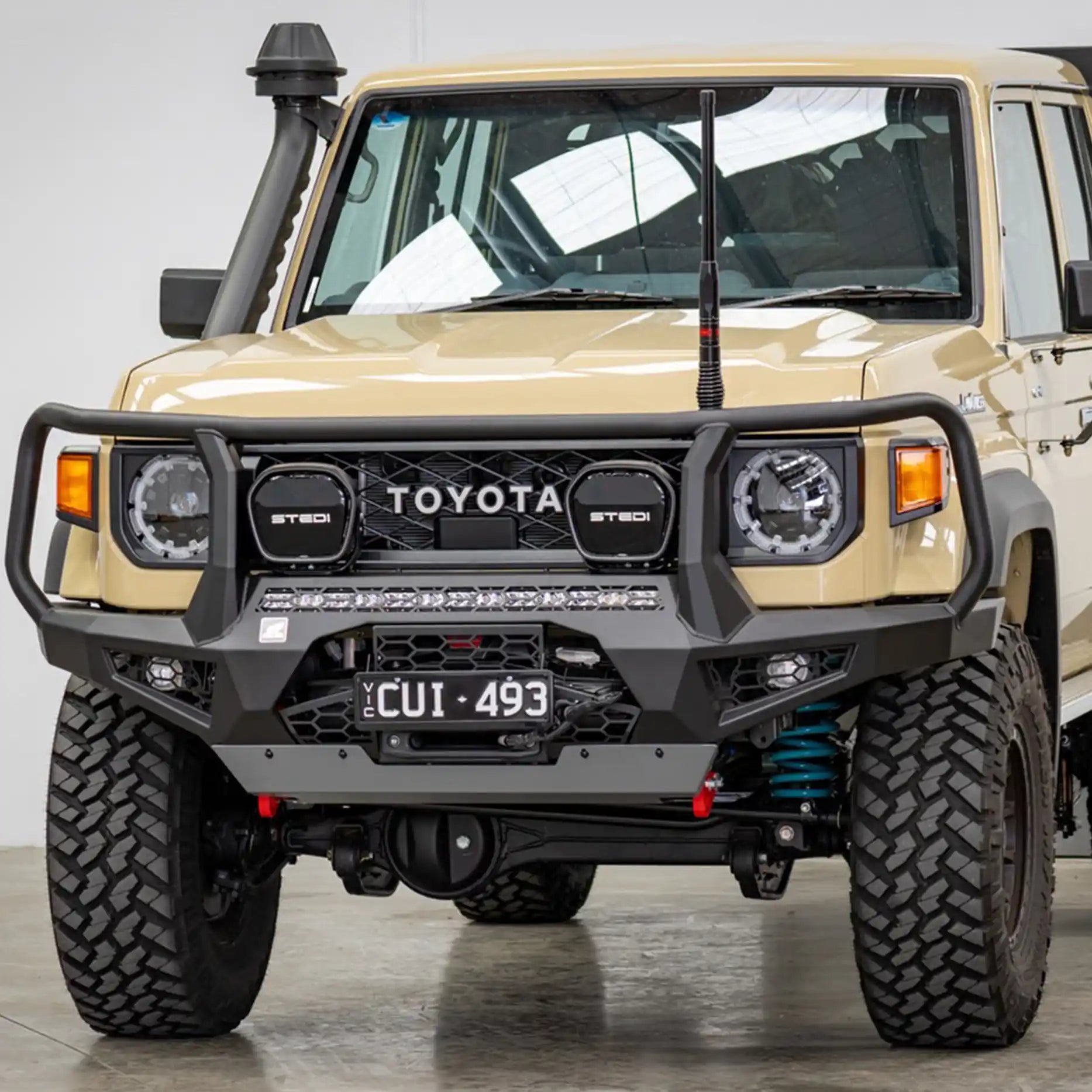 Left side profile of the Offroad Animal Toro Bull Bar on a 2024 Toyota Land Cruiser 78 Series widebody, highlighting its aggressive lines, perfect body fitment, and aerodynamic styling. Installed by Elevated 4x4, this bull bar enhances strength and airflow for superior off-road performance across Rutherford and Nelson Bay.