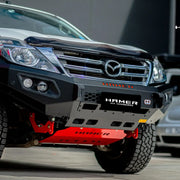 Left side view of Mazda BT-50 (2012–2020) with Hamer King Series Bull Bar, featuring matte black powder-coated finish, full bumper replacement design, and off-road-ready durability.