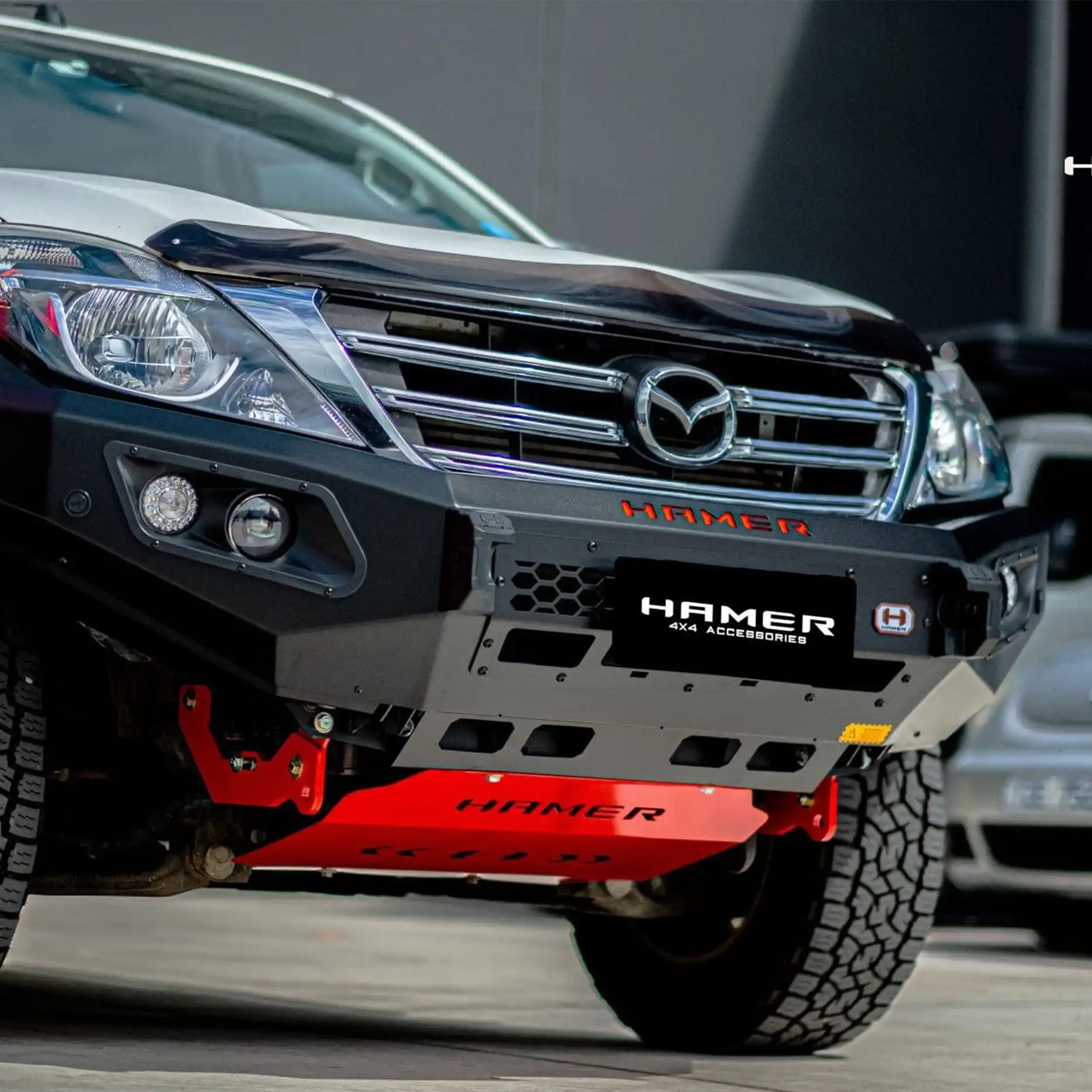 Left side view of Mazda BT-50 (2012–2020) with Hamer King Series Bull Bar, featuring matte black powder-coated finish, full bumper replacement design, and off-road-ready durability.