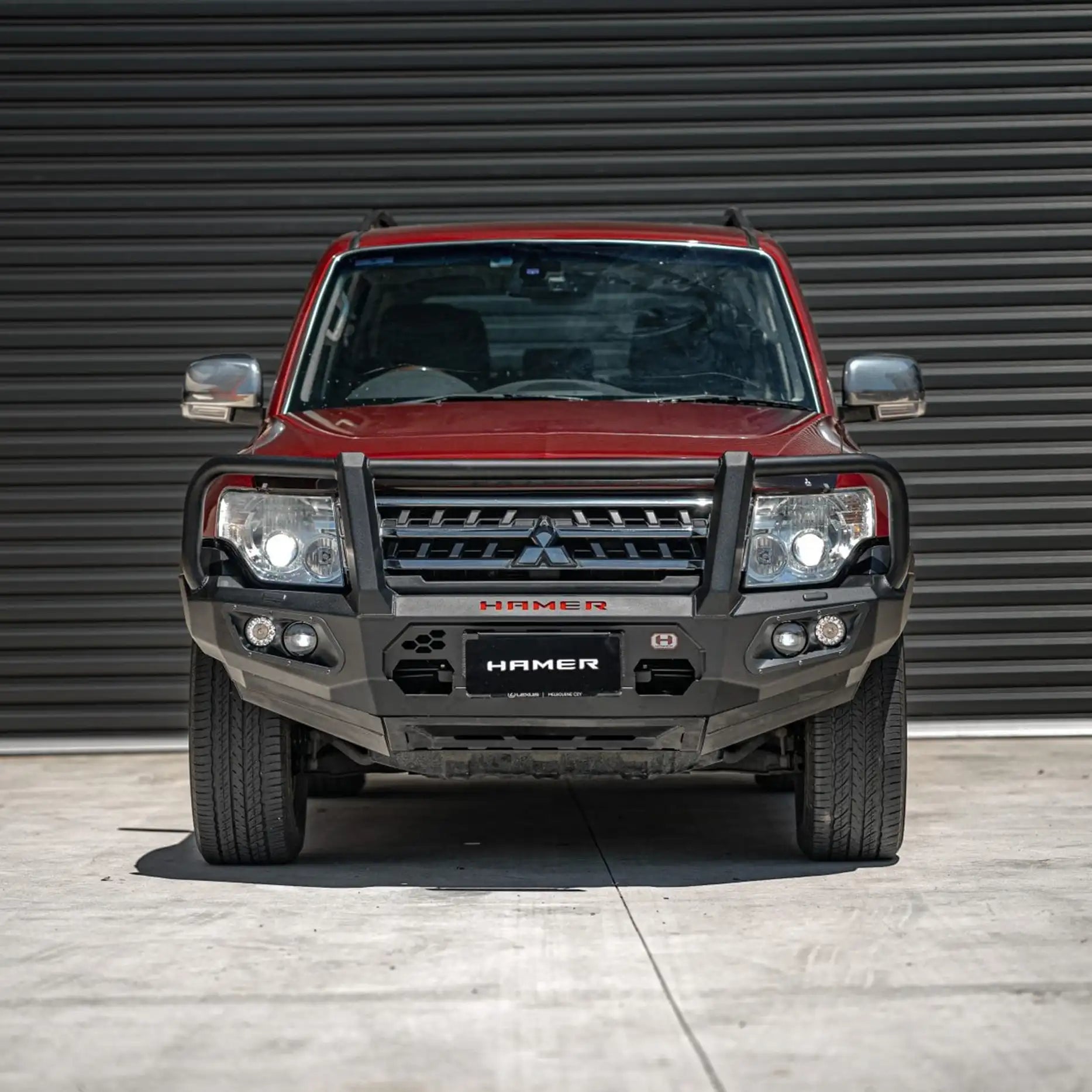 Front view of Mitsubishi Pajero (2006–2021) fitted with Hamer King Series Plus Bull Bar, full bumper replacement with steel strength and ADR compliance.