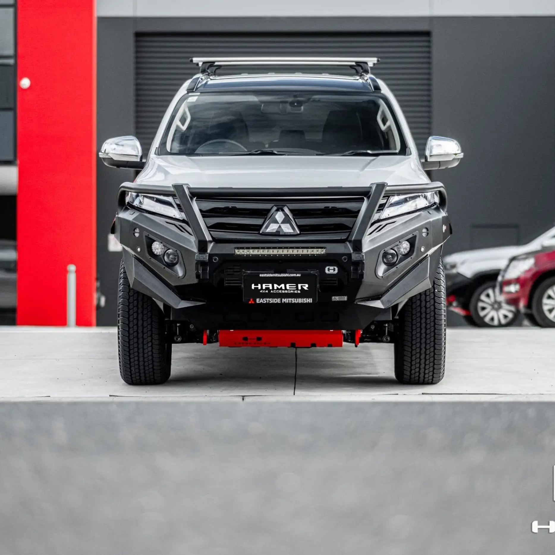 Mitsubishi Pajero Sport QF with Hamer King Plus Bull Bar, showing strong steel build, LED lights, and integrated recovery points.