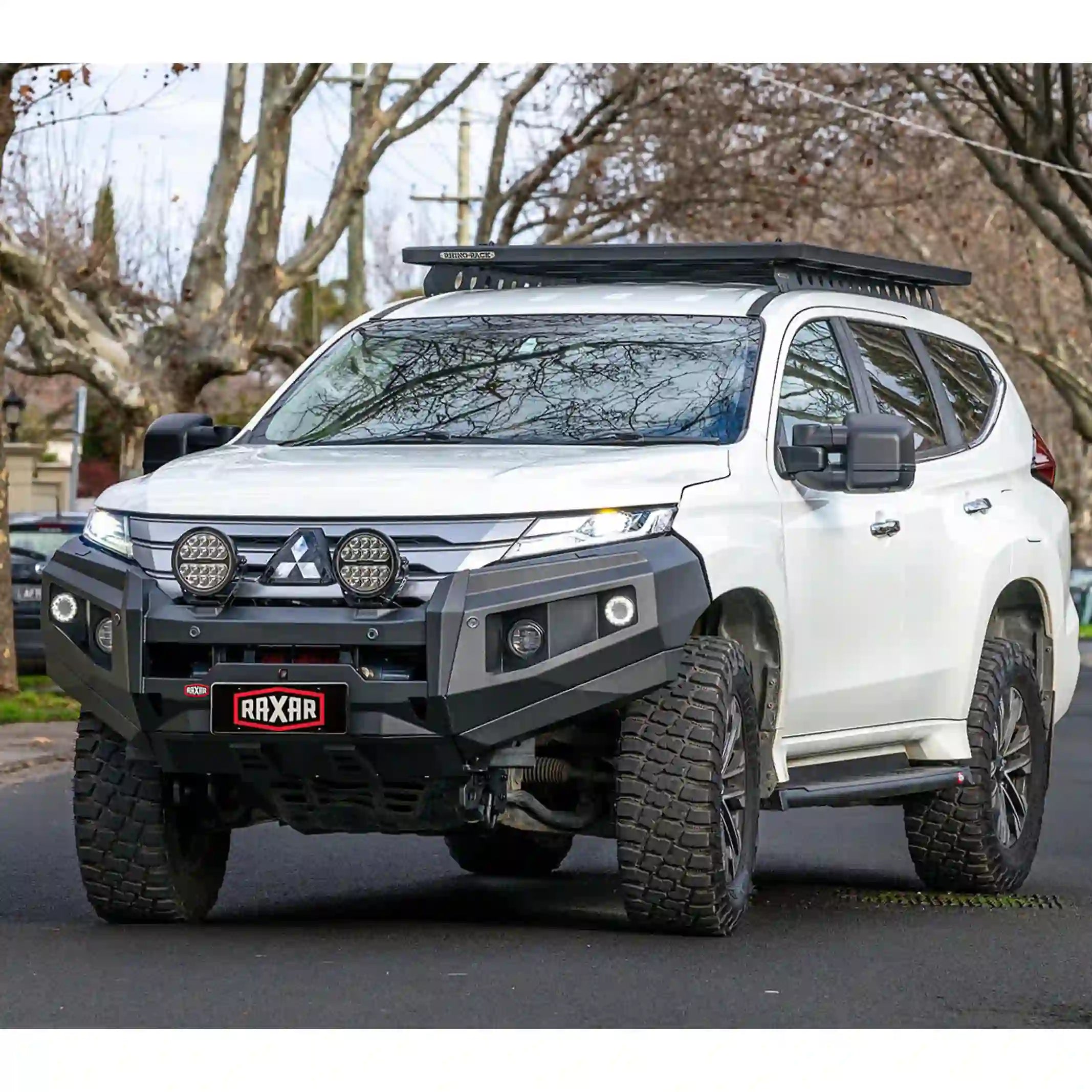 Right side view of Mitsubishi Pajero Sport QF with RAXAR no loop bull bar installed, showing bumper replacement design, recovery points, and fog light compatibility. Designed for strength and performance, available across Australia through Elevated 4x4.