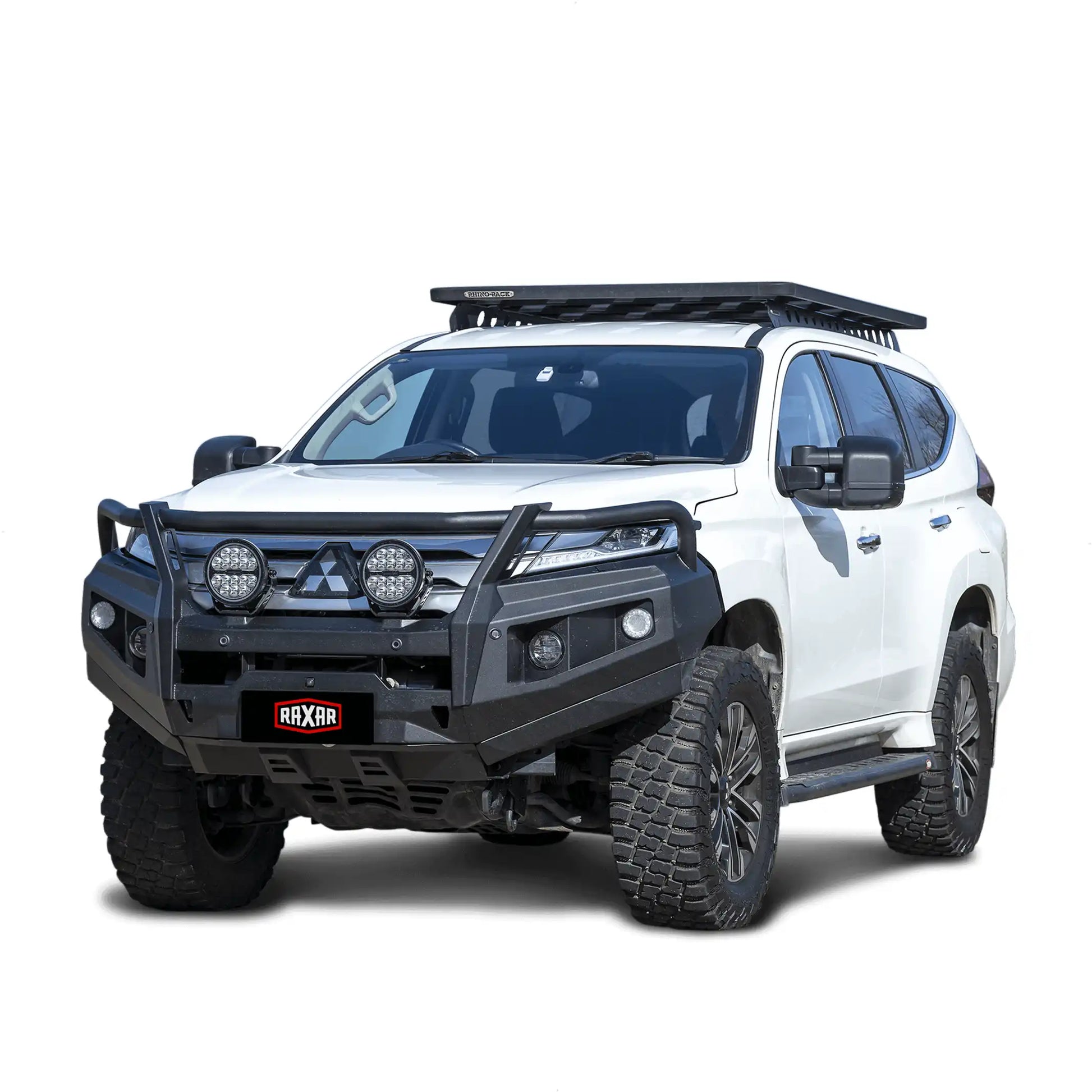 Left side view of a Mitsubishi Pajero Sport QF equipped with a RAXAR OF looped bull bar, featuring underbody bash plates, airflow split pan design, and antenna tabs. Built tough for off-road adventures and city driving, supplied by Elevated 4x4.