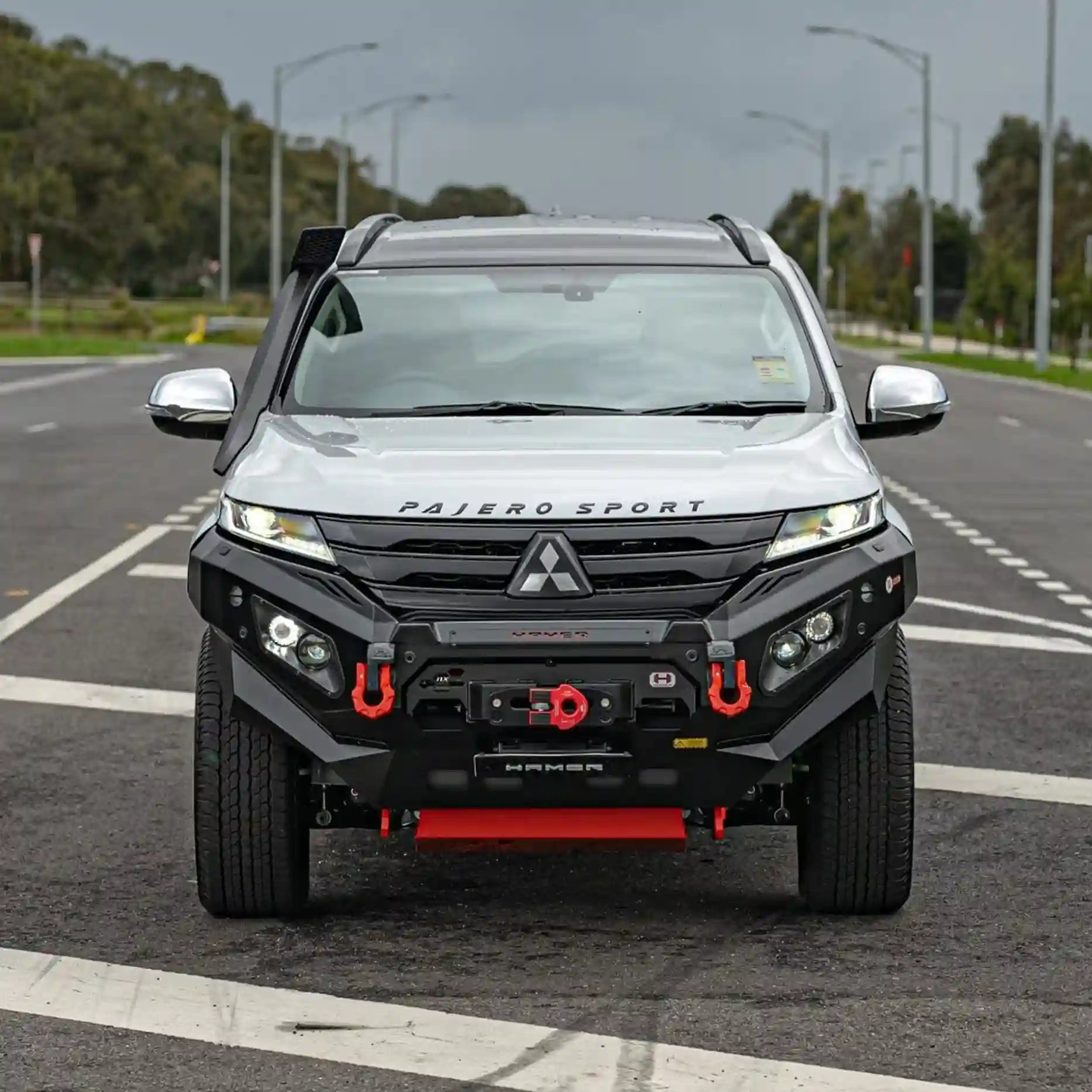 Front angle of Mitsubishi Pajero Sport QG (2024–Present) fitted with Hamer King Bull Bar, a 3mm steel ADR-compliant bumper with LED lighting.