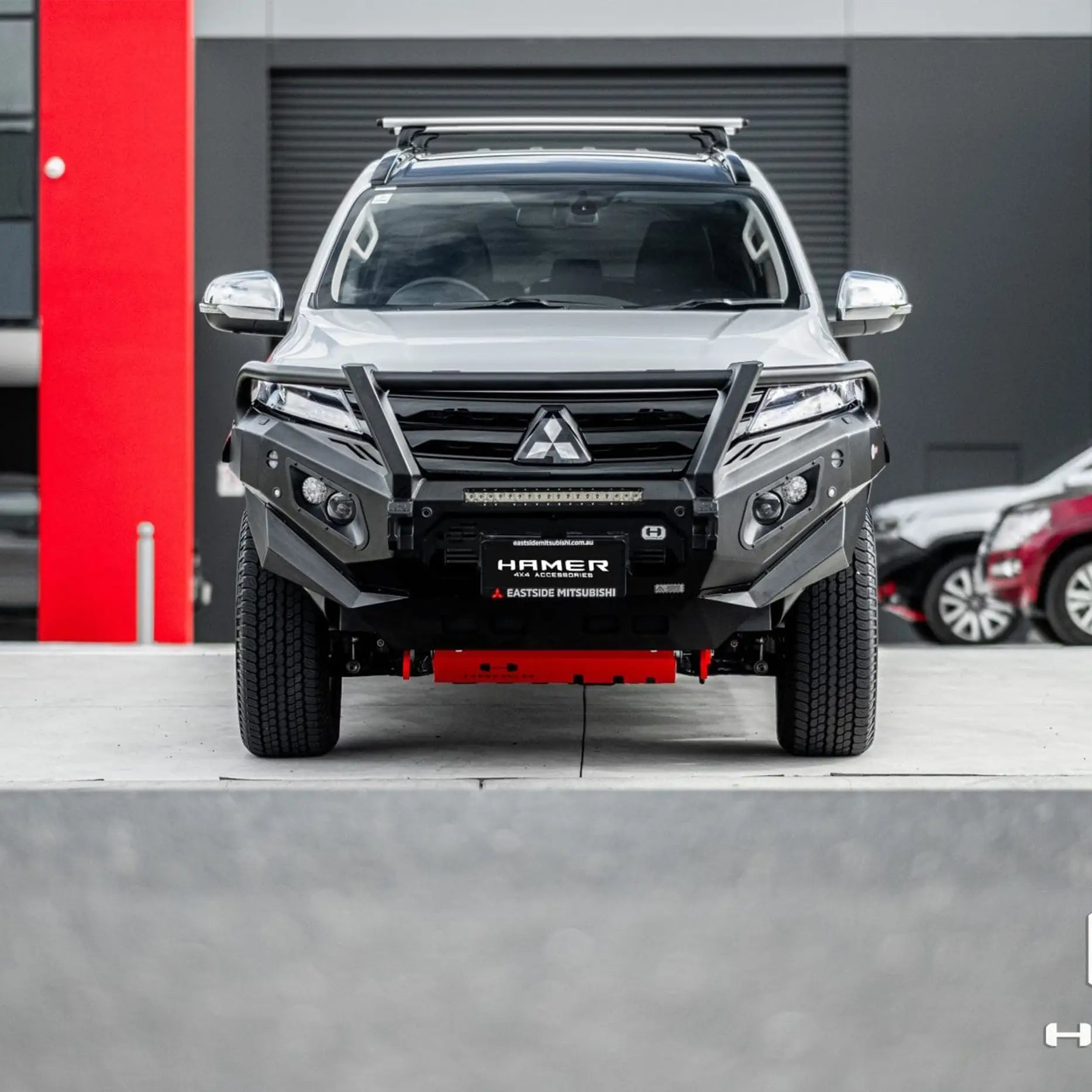 Front angle of Pajero Sport QG fitted with Hamer King Plus Bull Bar, ADR compliant steel bumper with LED lights and recovery points.