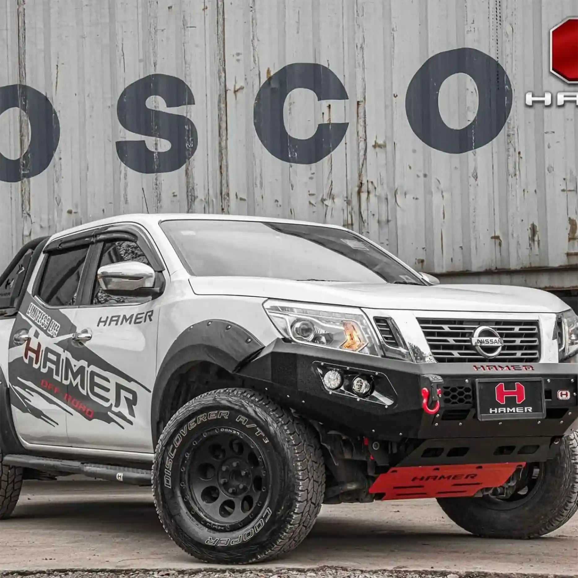 Left-side angle of Hamer King Series Bull Bar on Nissan Navara NP300 (2015–2020), showing sleek integration, recovery points, and matte black finish.