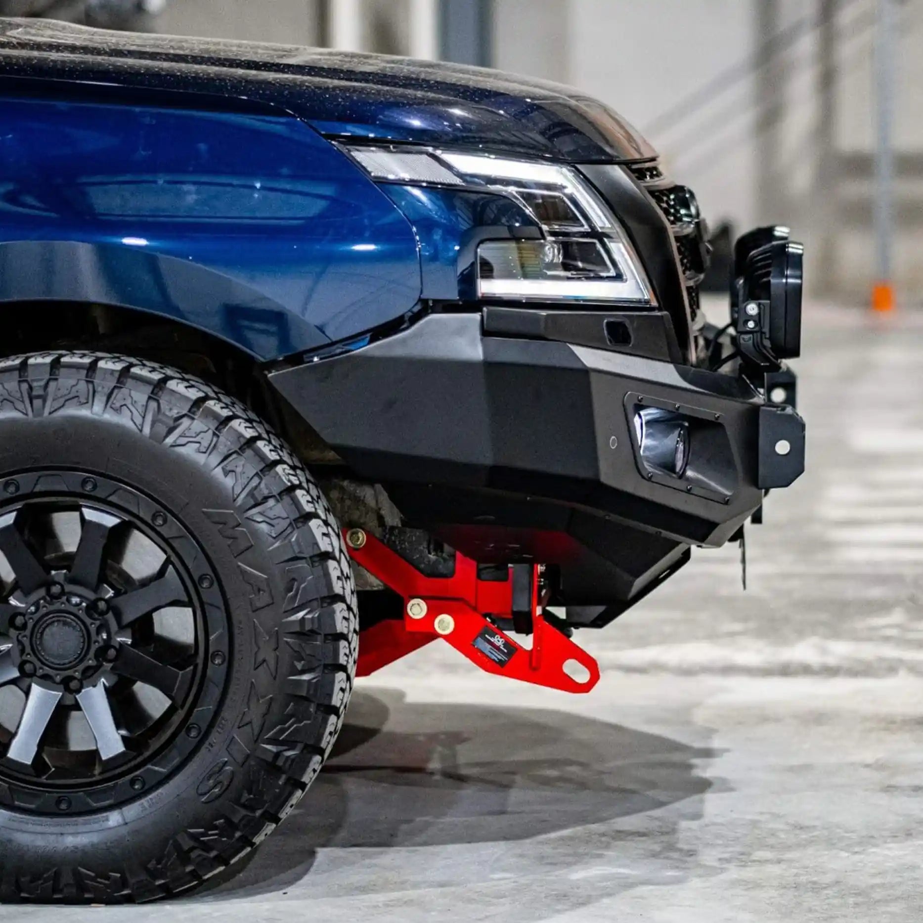 Left side view of Nissan Patrol Y62 highlighting the Hamer King Bull Bar with radar module and parking sensor integration.