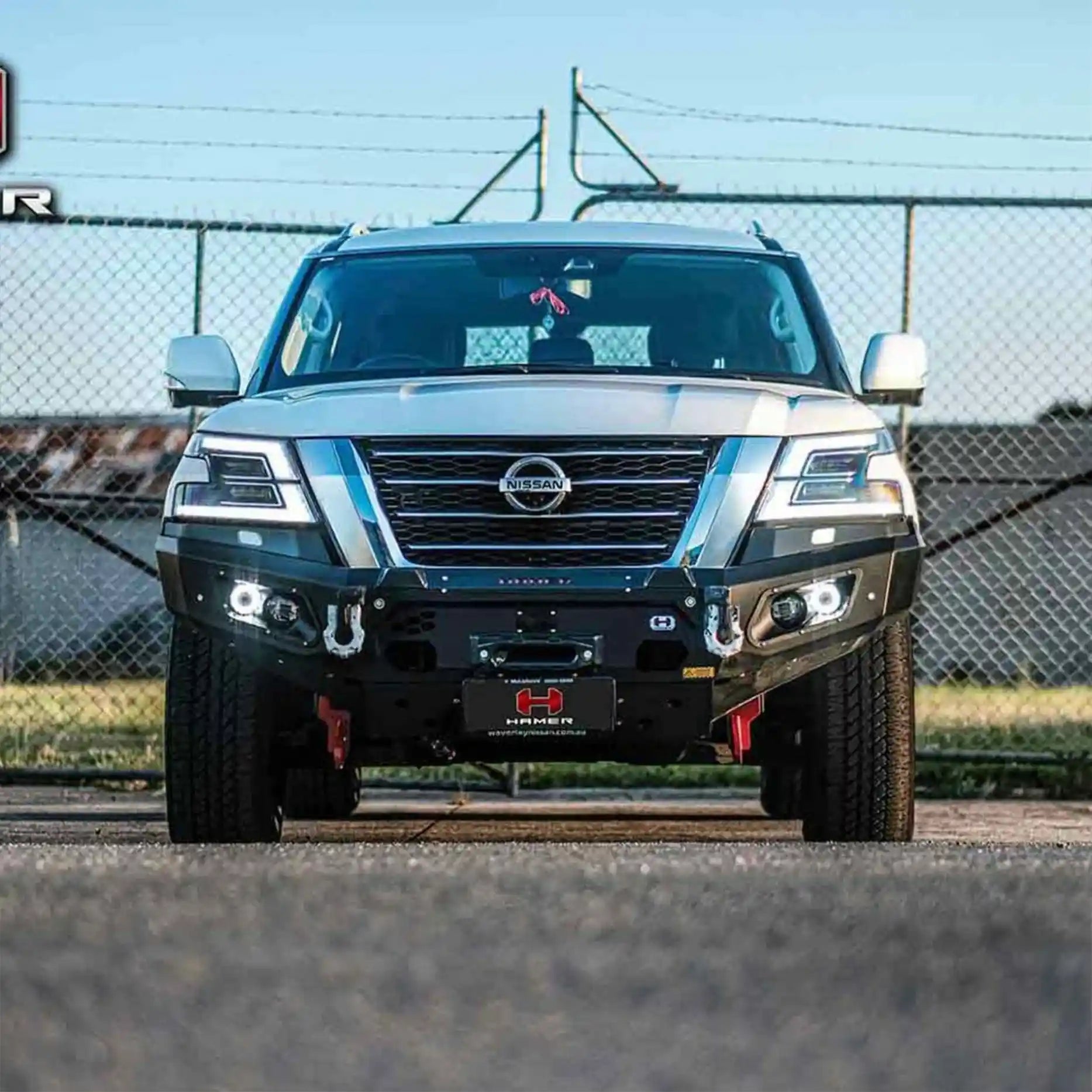  Front view of Nissan Patrol Y62 fitted with Hamer King Series Bull Bar, 3mm steel, ADR compliant, and rugged matte black style.
