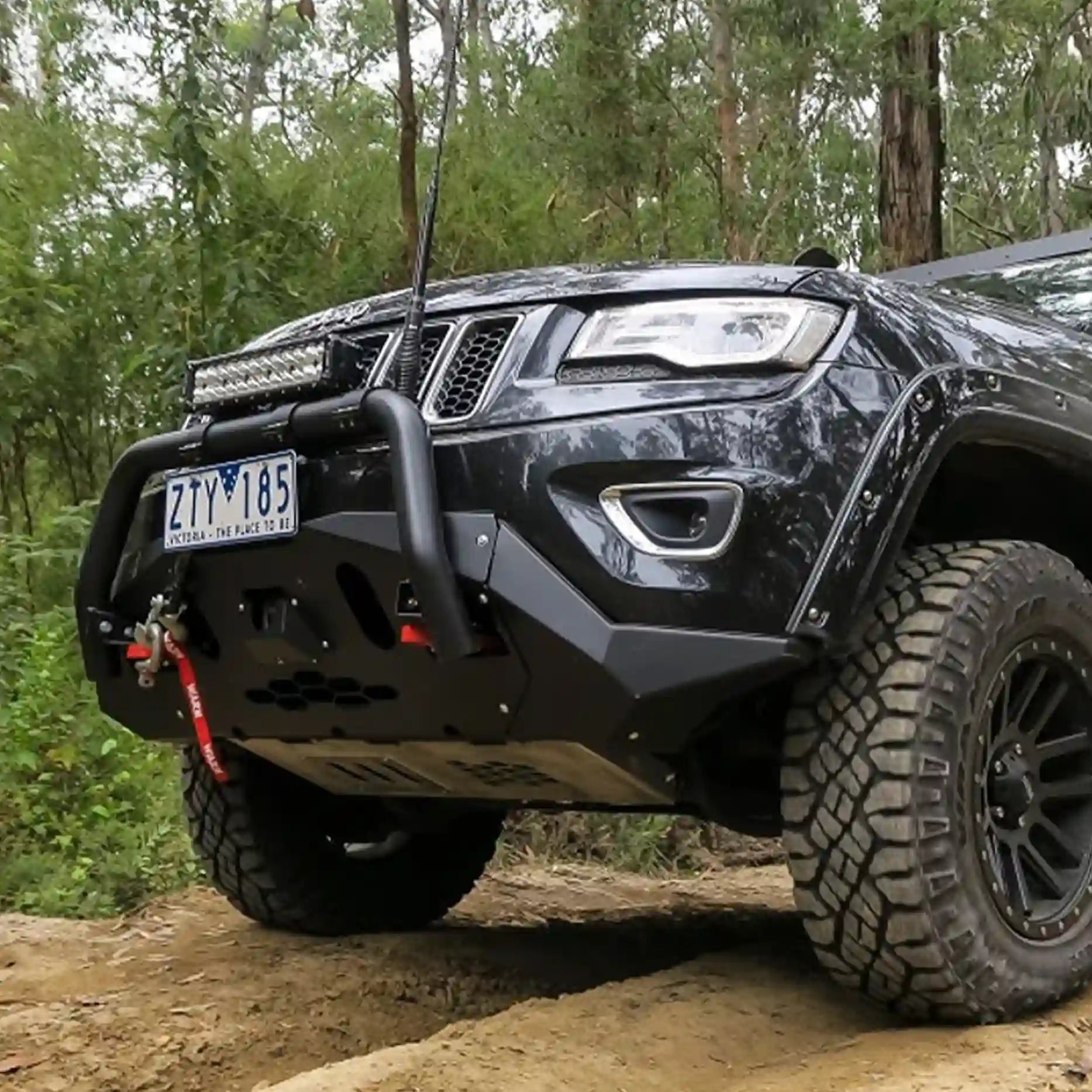 Left off-road view of the Offroad Animal Nudge Bar on a Jeep Grand Cherokee WK2, capturing its powder-coated matte black finish and solid steel build. Installed by Elevated 4x4, it enhances front-end strength and gives a commanding off-road appearance around Newcastle and the Central Coast.