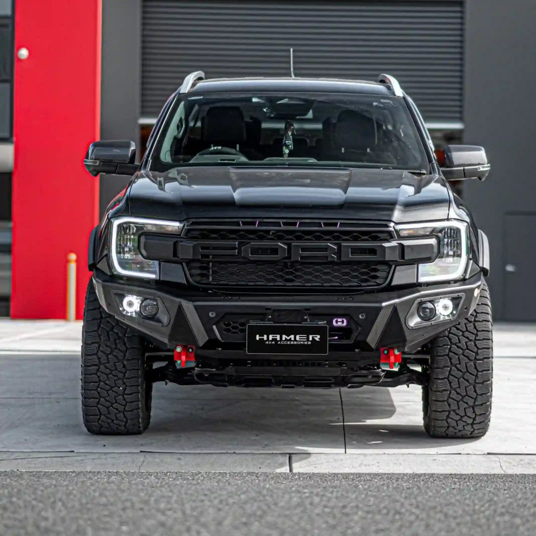 Off-road front view of Hamer 4x4 King Series Bull Bar on Ford Ranger (2022–Present), showing rugged bumper replacement, LED lights, and durable matte black build.