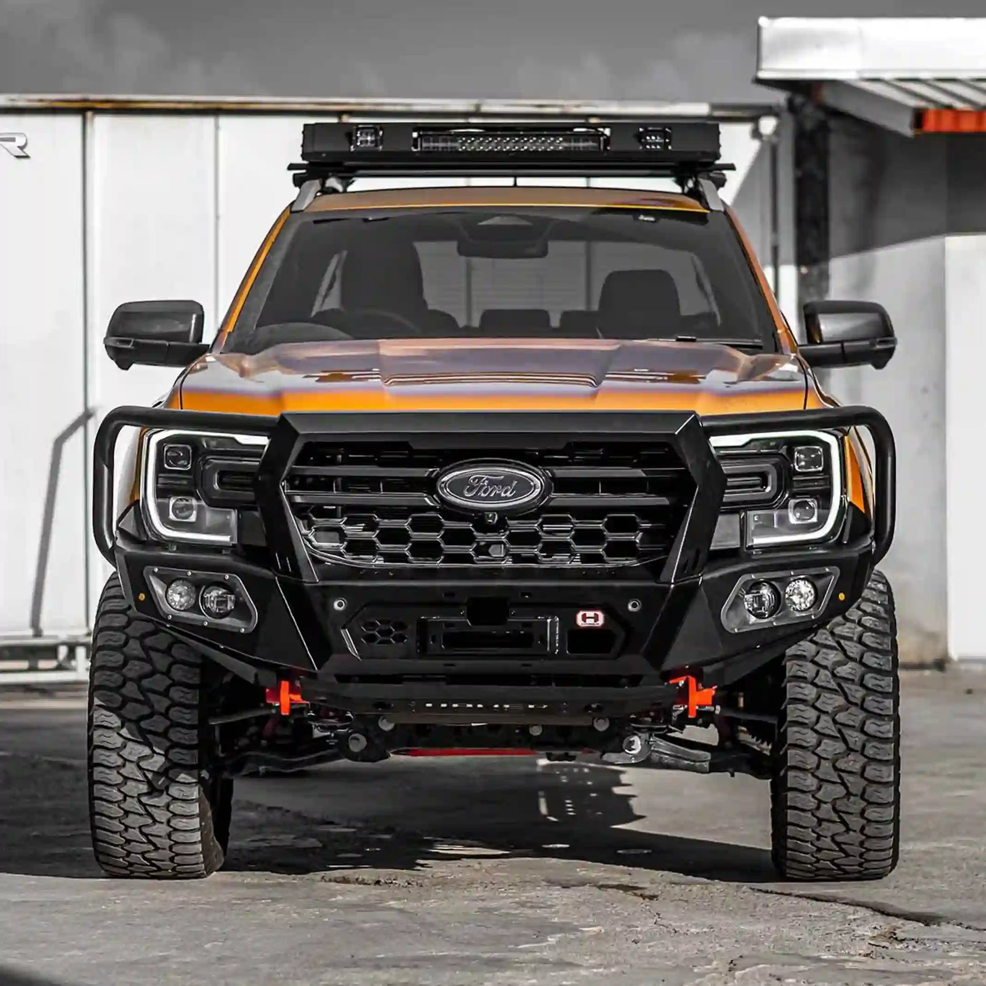 Front off-road view of Hamer 4x4 King Series Plus Bull Bar on Ford Ranger (2022–Present), showing full bumper replacement, integrated LED lights, and rugged construction.