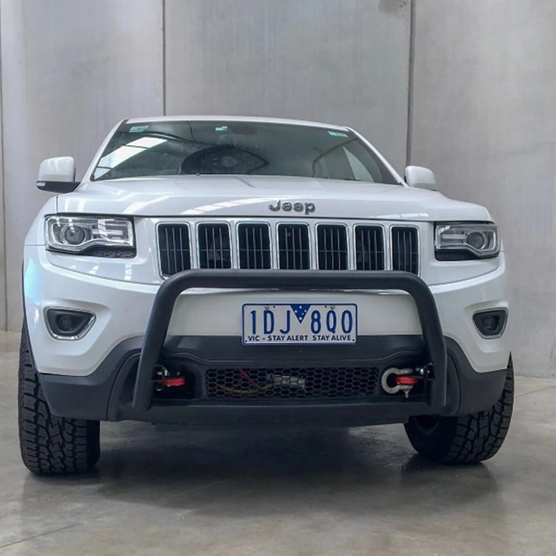Front view of the Offroad Animal Nudge Bar fitted to a Jeep Grand Cherokee WK2, showing its 2.5-inch steel tubing and clean matte black finish. Installed by Elevated 4x4, this durable bar adds functional front-end protection and aggressive style for Newcastle and Hunter Valley 4WD enthusiasts.