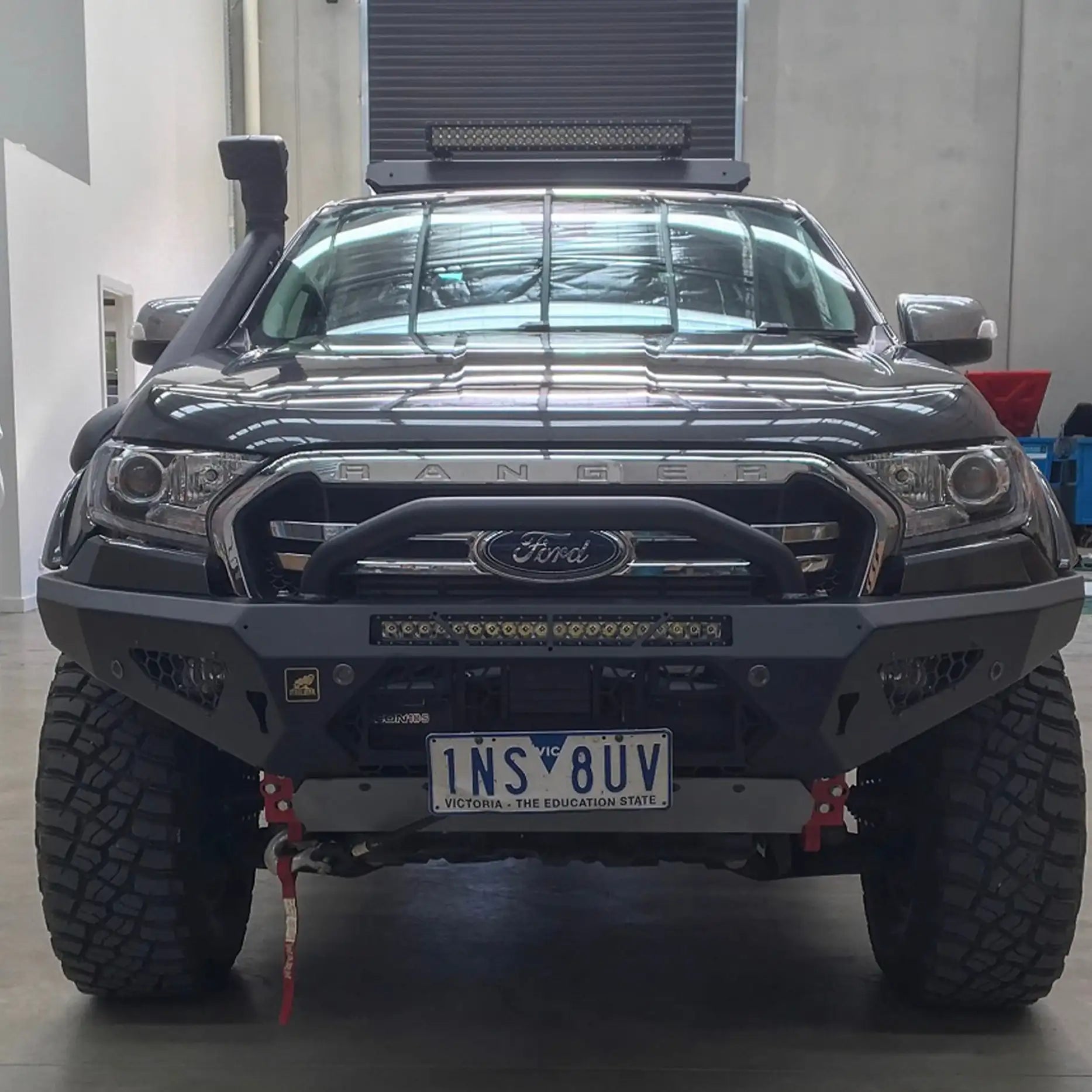 Installed front view of the Offroad Animal Predator Bull Bar on a Ford Ranger PX1, showcasing its bold matte black finish and aggressive off-road stance. Available through Elevated 4x4 Australia, this bull bar adds serious strength, superior airflow, and head-turning design while maintaining ADR compliance and winch compatibility for everyday and adventure use.