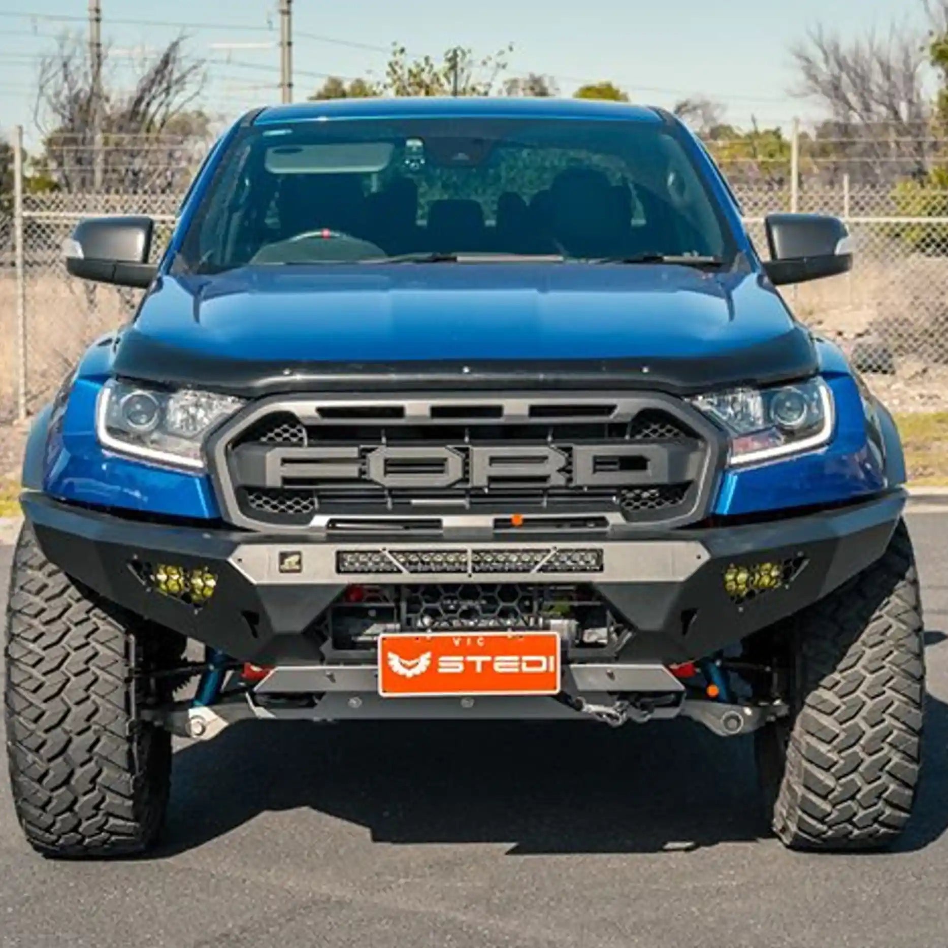 Installed front view of the Offroad Animal Predator Bull Bar on a Ford Ranger Raptor, showcasing its aggressive matte black finish and precise bumper replacement design. Available from Elevated 4x4 Australia, this ADR-compliant bull bar adds rugged off-road strength, improved airflow, and standout street presence to your 2018–2022 Raptor.
