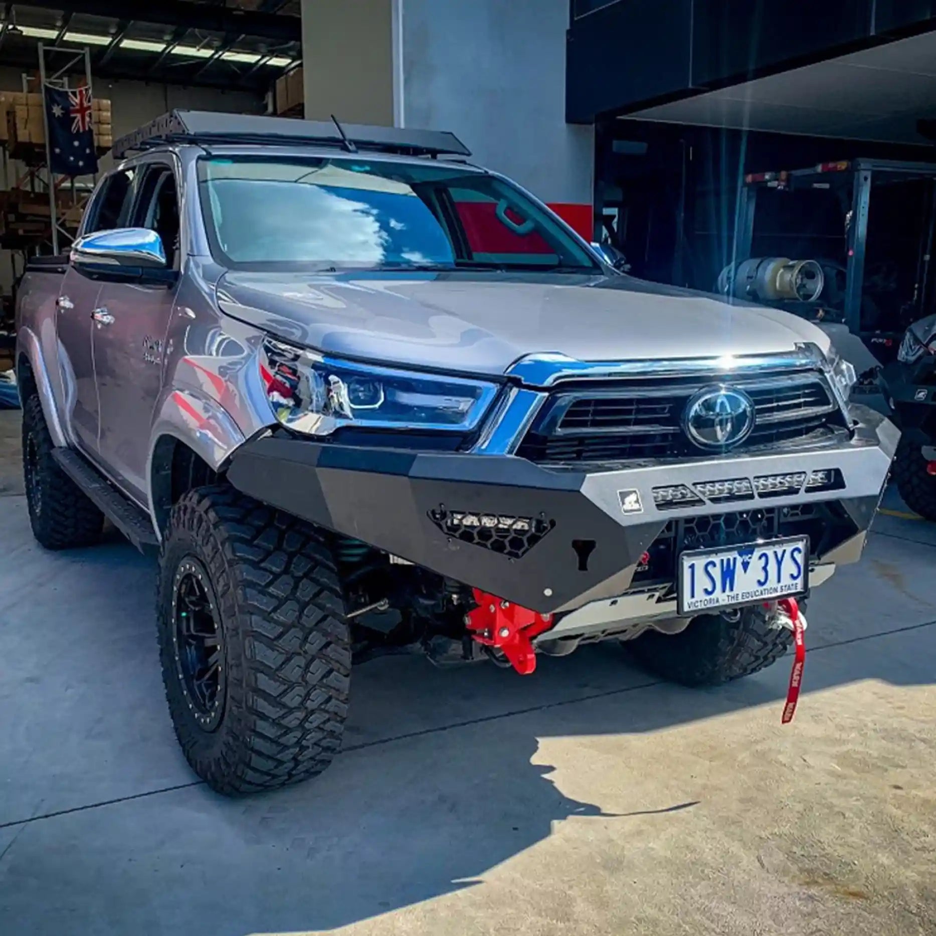 Right side perspective of the Offroad Animal Predator Bull Bar on a Toyota Hilux N80 MY21, displaying robust tow points and precision-fit steel fabrication. Designed and supplied by Elevated 4x4, this bull bar boosts protection and performance for off-road adventures from the Central Coast to the Hunter region.