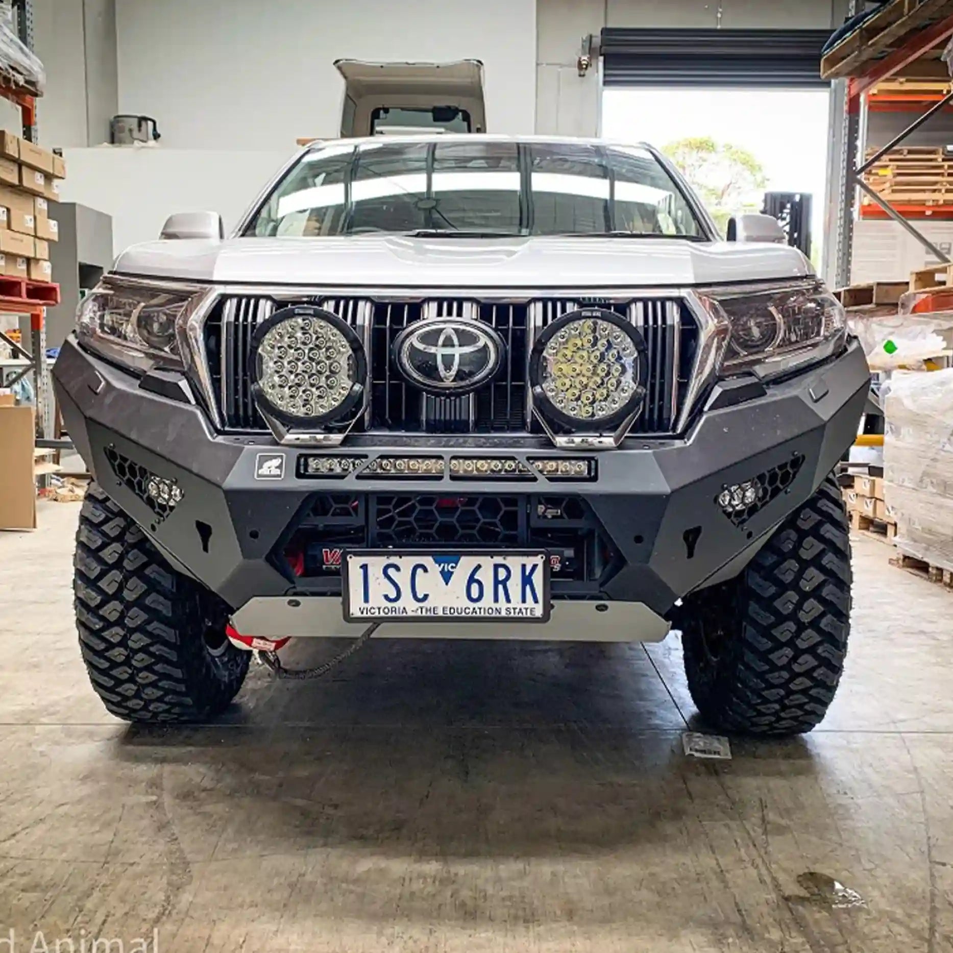 Close-up front angle of the Offroad Animal Predator Bull Bar on a Toyota Prado 150 Series, highlighting precision welds, adaptive cruise radar compatibility, and factory fog light fitment. Installed by Elevated 4x4, it blends rugged protection with refined design for 4WD enthusiasts across Maitland and Rutherford.