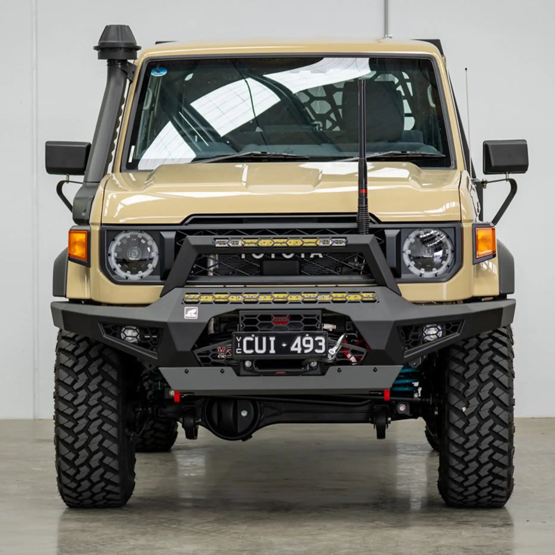 Front view of the Offroad Animal Predator Bull Bar on a 2024 Toyota Land Cruiser 79 Series, showing its modern facelift styling, matte black finish, and robust one-piece design. Professionally fitted by Elevated 4x4, this bull bar enhances airflow, winch compatibility, and off-road performance across Newcastle and the Hunter region.