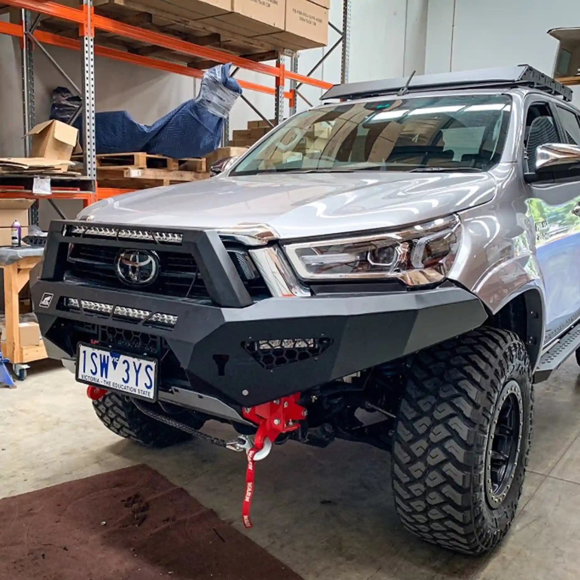 Close front shot of the Offroad Animal Predator Bull Bar fitted to a 2020 Toyota Hilux N80, highlighting its one-piece welded construction and stealth LED light bar integration. Perfectly crafted by Elevated 4x4, this bar delivers superior protection and street-ready style for drivers in Cardiff and Maitland.