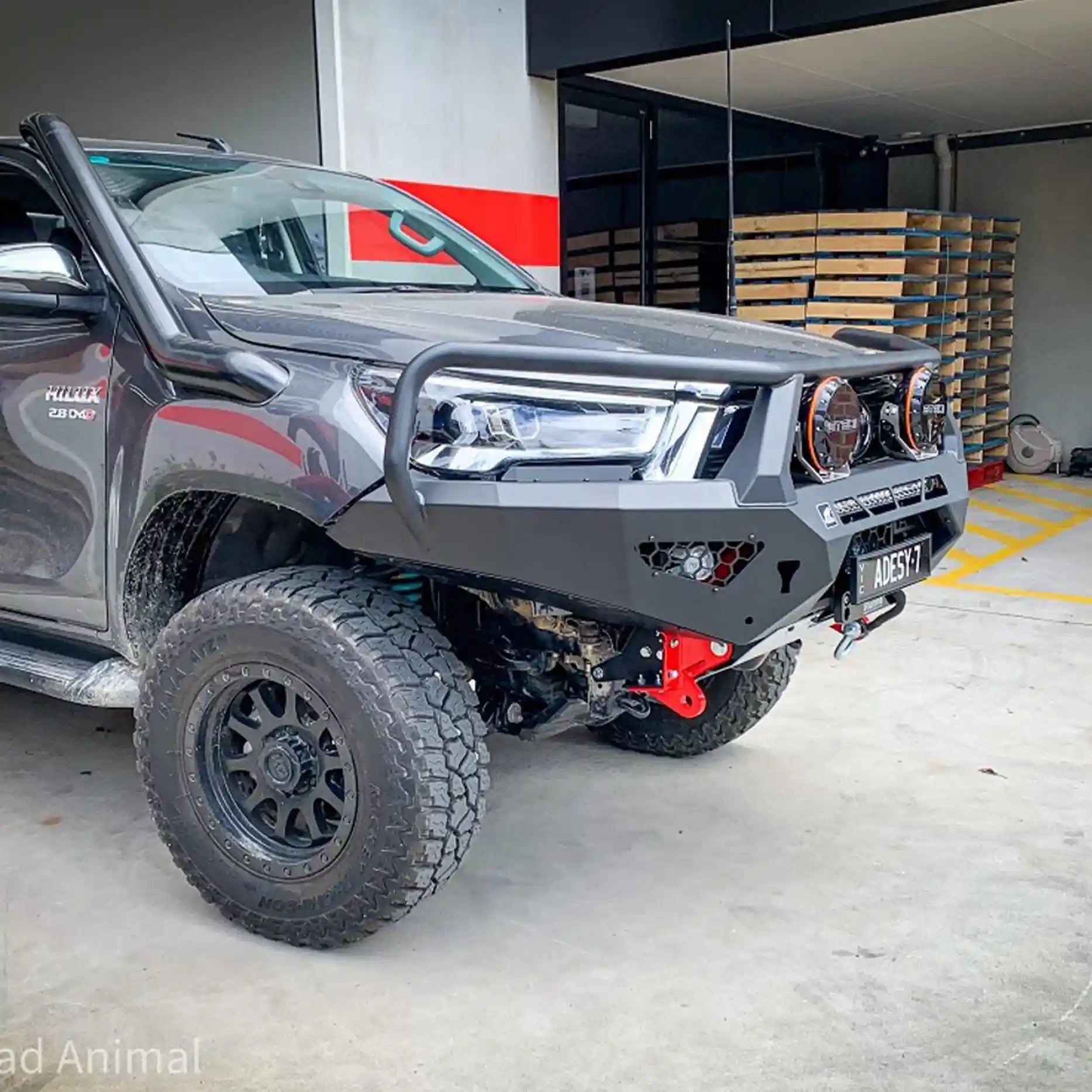 Right side angle of the Offroad Animal Toro Bull Bar on a Toyota Hilux N80 MY21, highlighting durable steel tow hooks and seamless integration with factory sensors. Professionally supplied by Elevated 4x4, this premium bull bar provides strength, style, and protection for 4WD enthusiasts across Nelson Bay and Port Stephens.