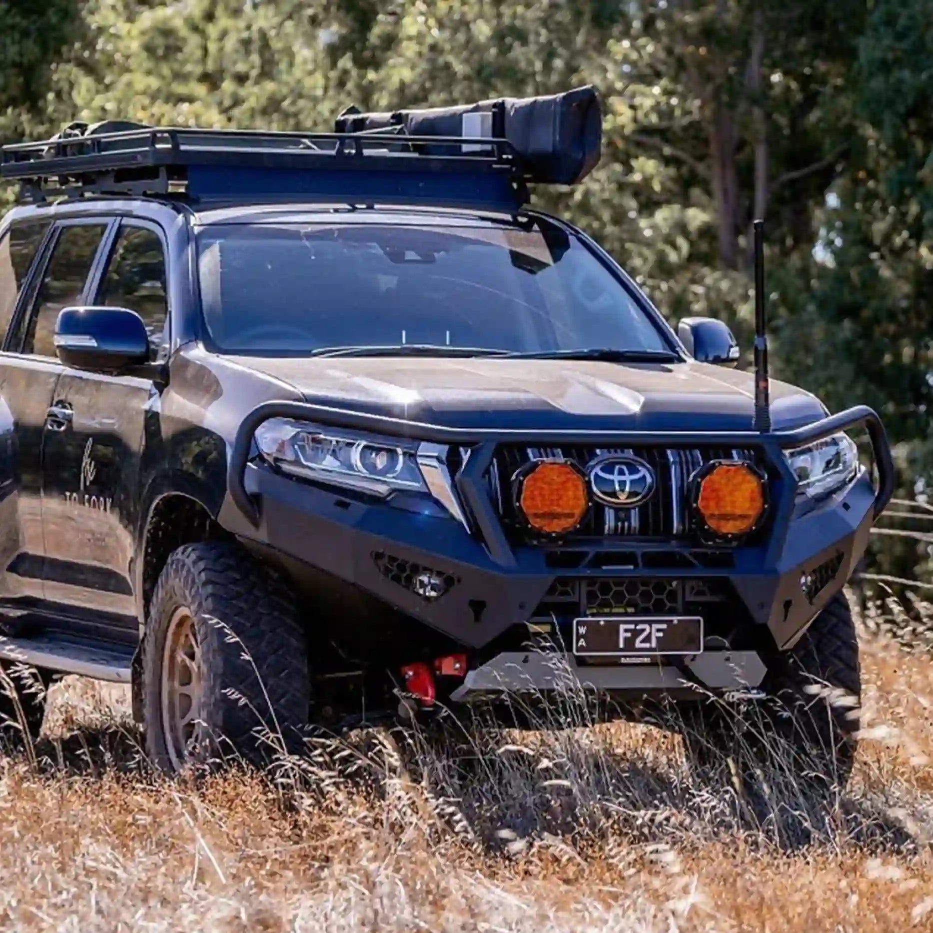 Right side angle of the Offroad Animal Toro Bull Bar mounted on a Toyota Prado 150 Series, displaying its robust wing supports, integrated bash plate, and modern off-road aesthetic. Installed by Elevated 4x4, this design delivers strength, safety, and standout looks for off-roaders across the Hunter and Central Coast.
